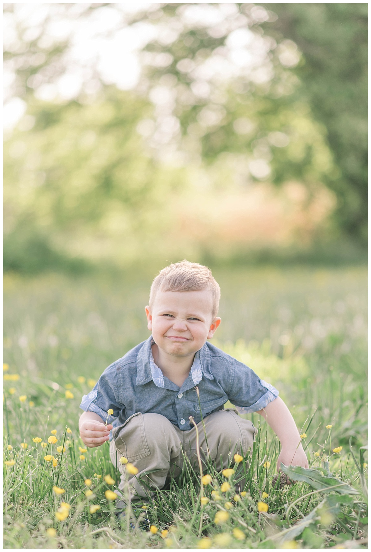 little boy picking wildflowers in a southern maryland field
