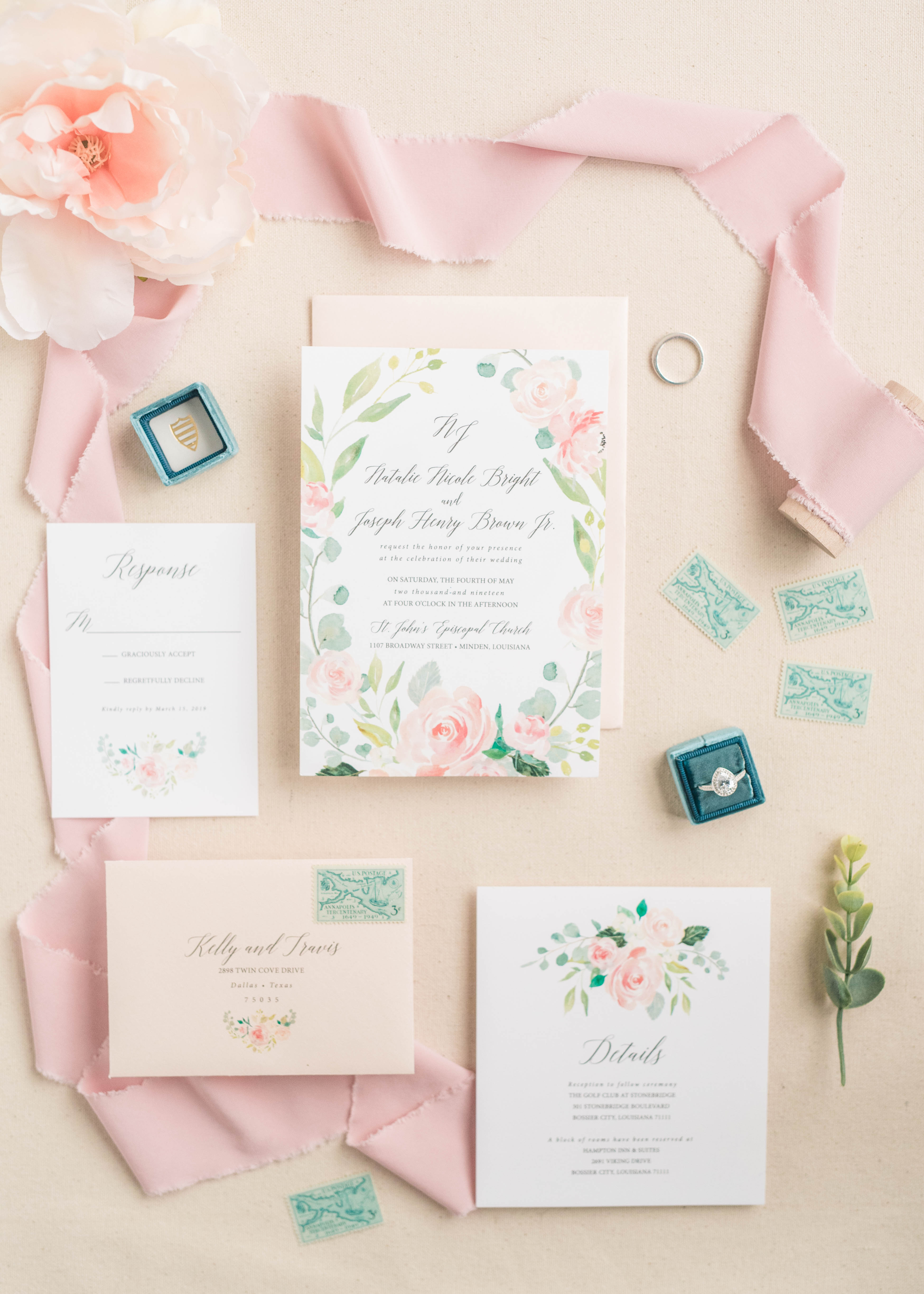 wedding invitation, details, and engagement ring, styled with ribbon and floral accents