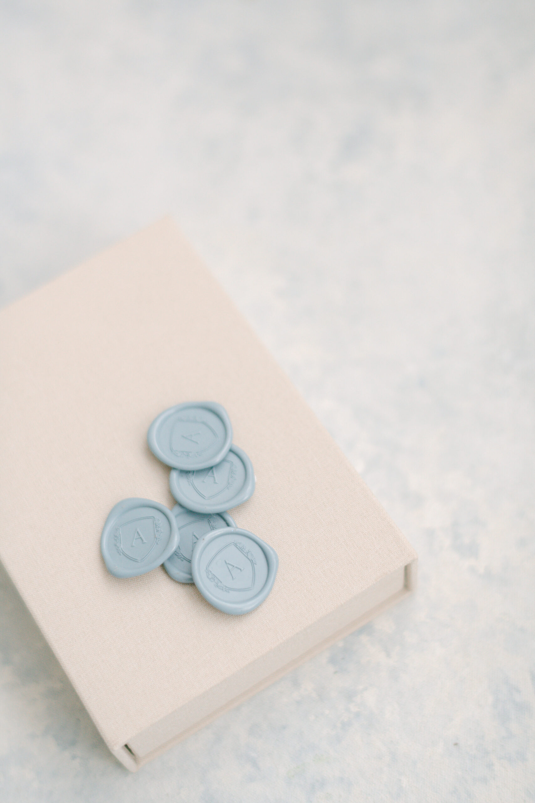 blue wax seals lay on album box for Maryland photographer