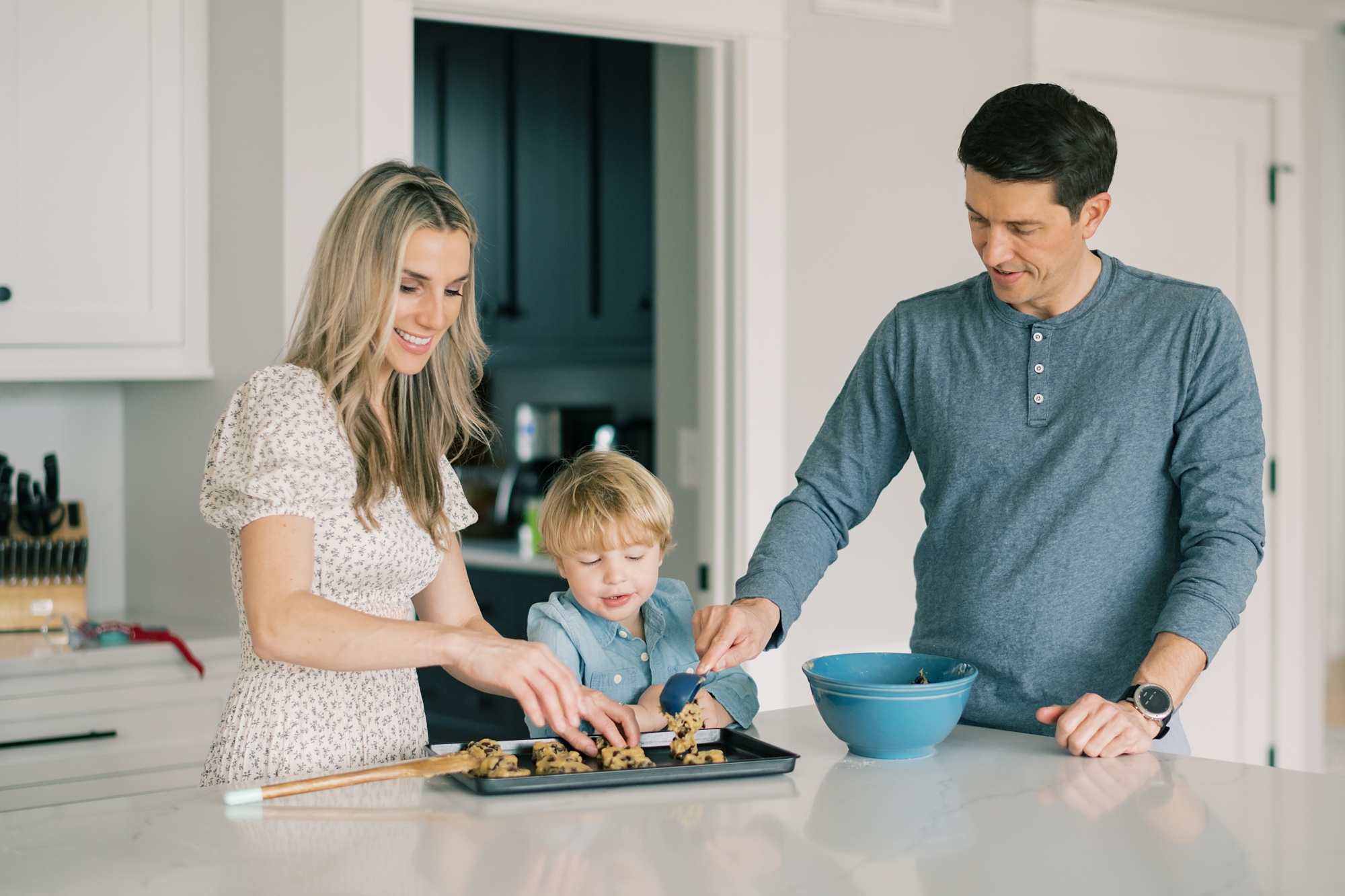 family makes cookies during lifestyle family portraits in Maryland 