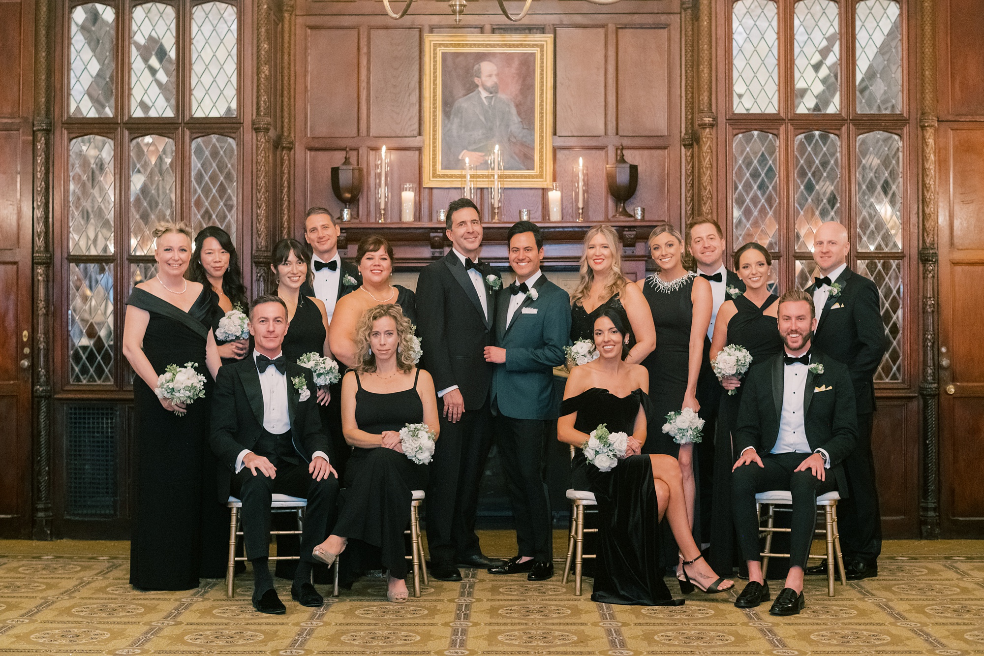 grooms pose with bridal party in black and white attire inside the Hay Adams Hotel