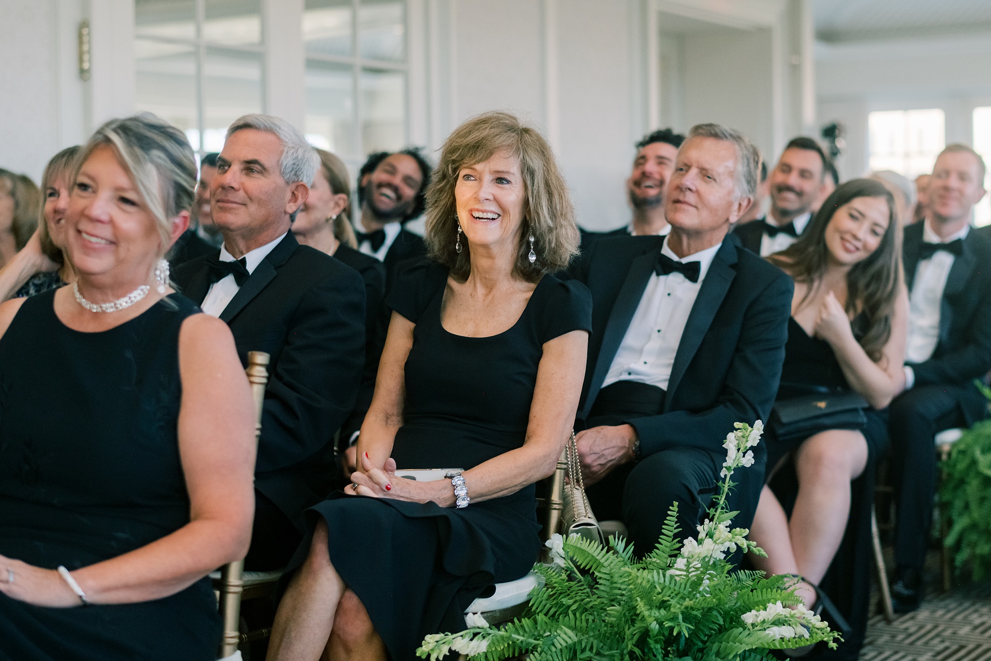 mother smiles sitting during ceremony at the Hay Adams Hotel