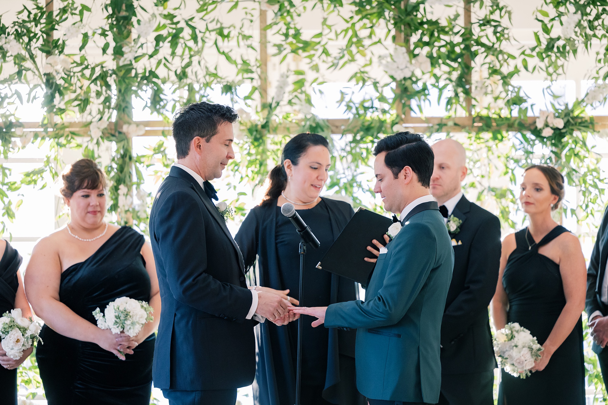 grooms exchange vows during ceremony at the Hay Adams Hotel