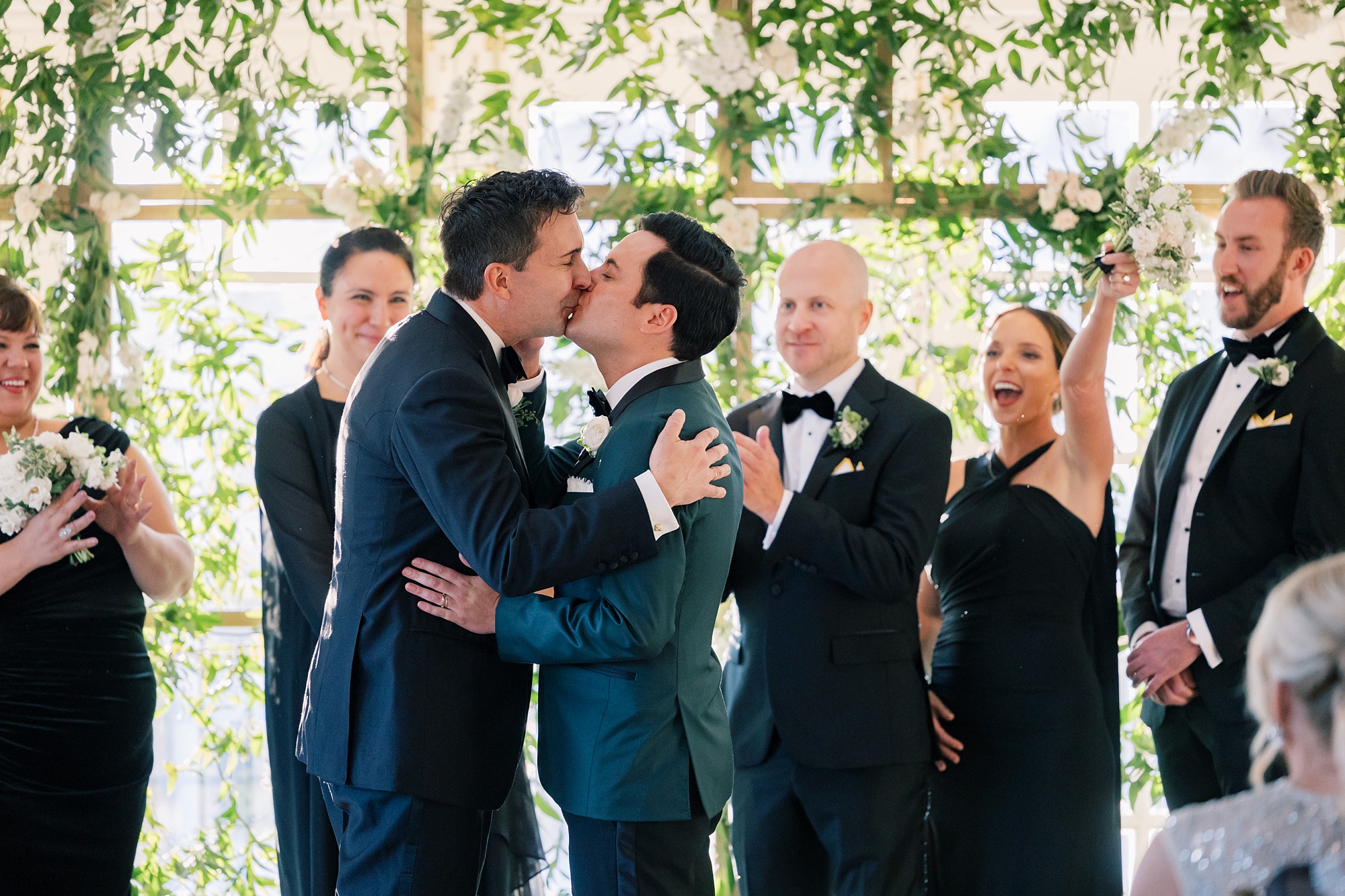 husbands kiss after ceremony at the Hay Adams Hotel