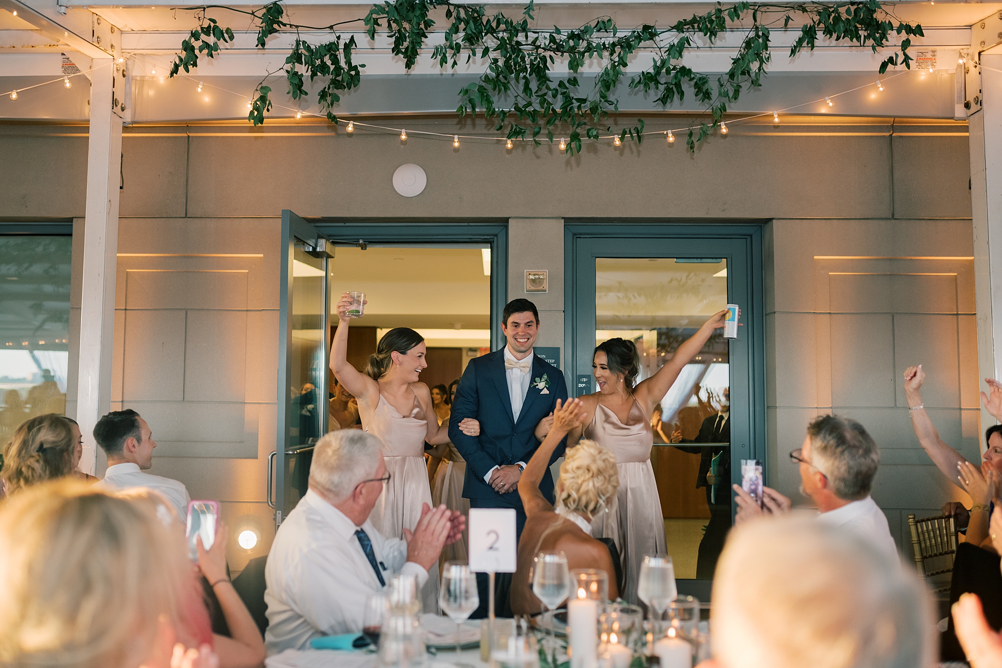 bride and groom cheer entering wedding reception at Potomac View Terrace