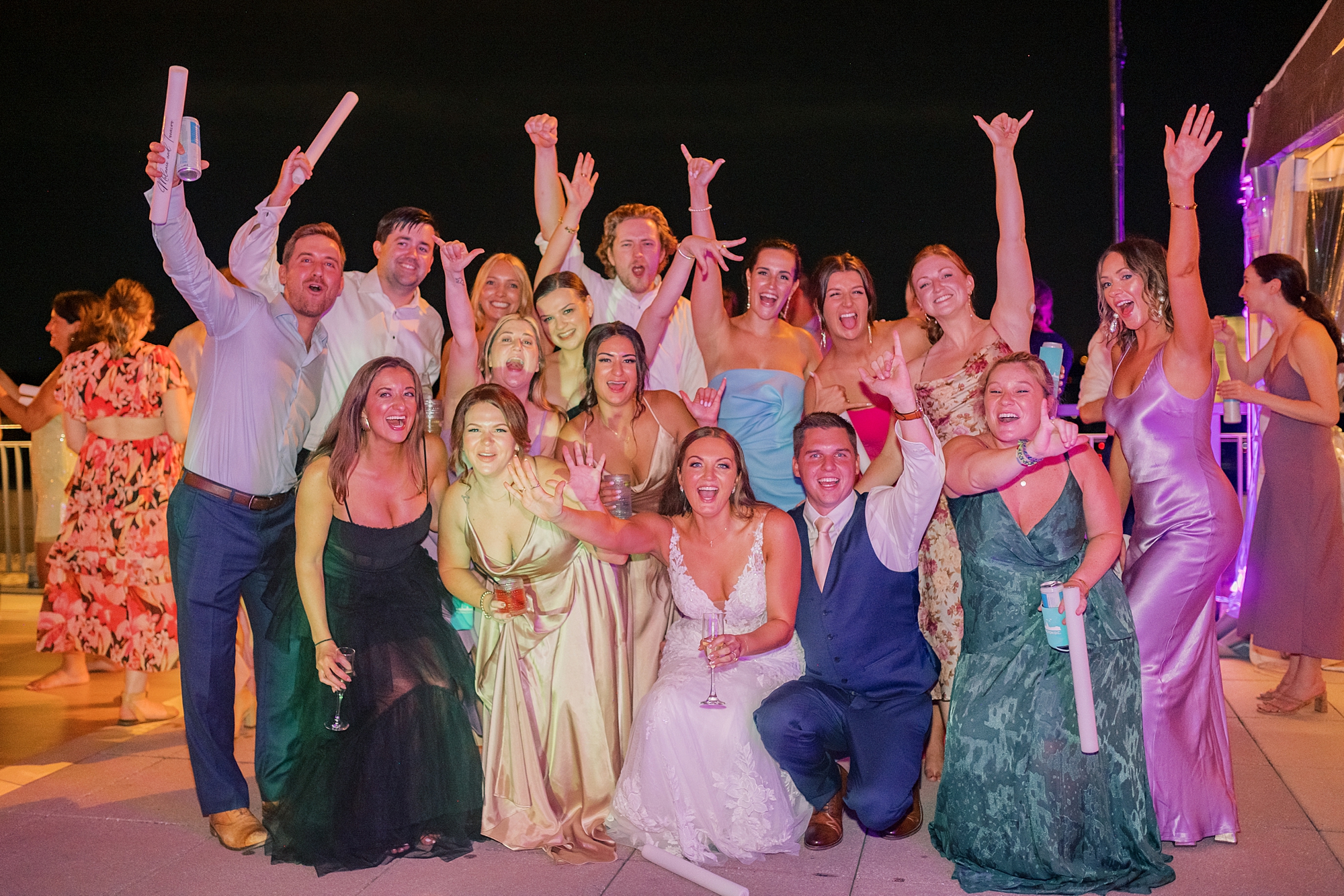 guests pose on side of dance floor at DC wedding reception