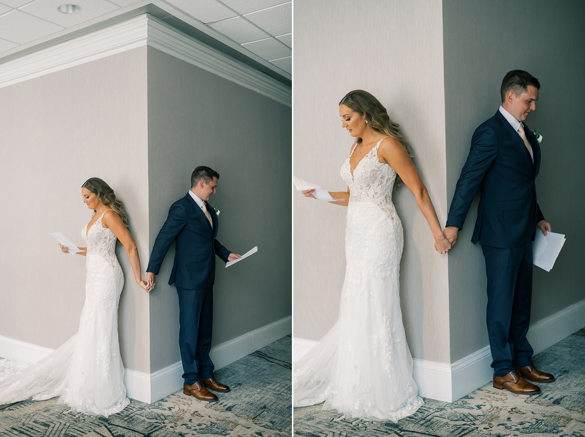 bride and groom hold hands around corner reading letters 
