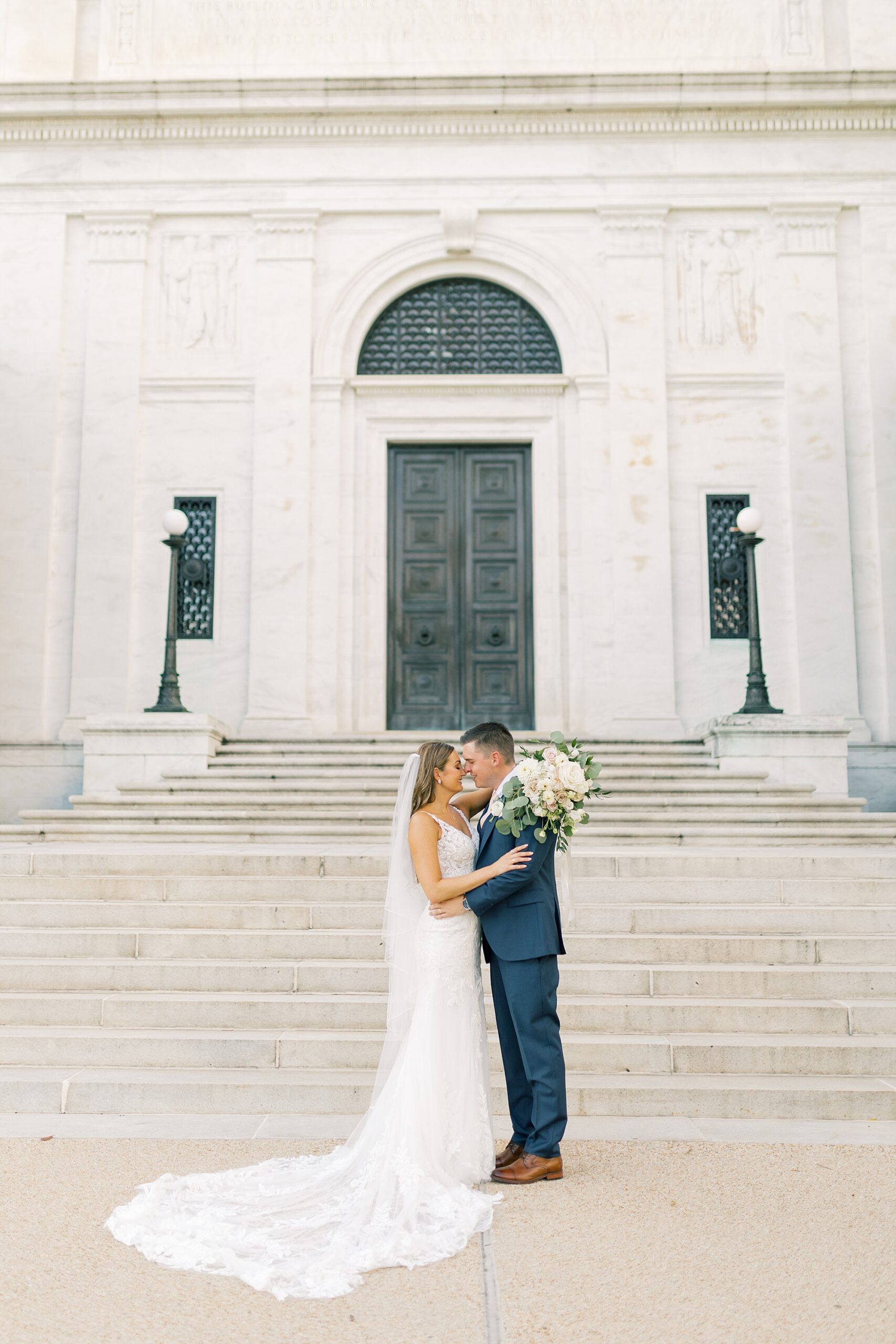bride and groom kiss outside Greek Orthodox Church in Washington DC