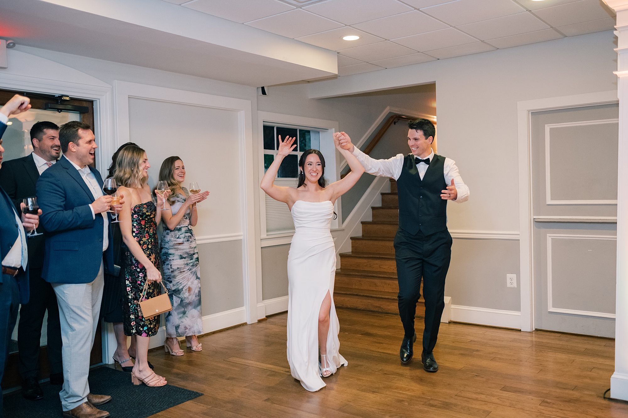 bride and groom enter reception at Herrington on the Bay