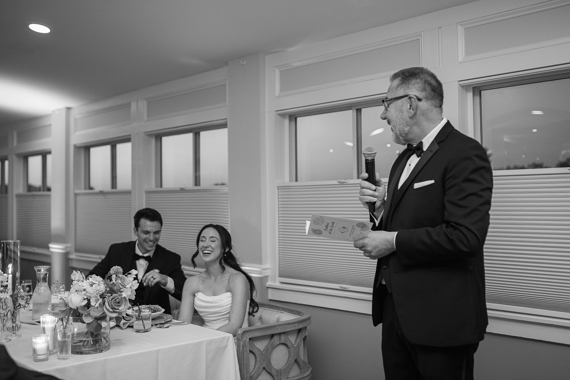 father gives speech at wedding reception at Herrington on the Bay