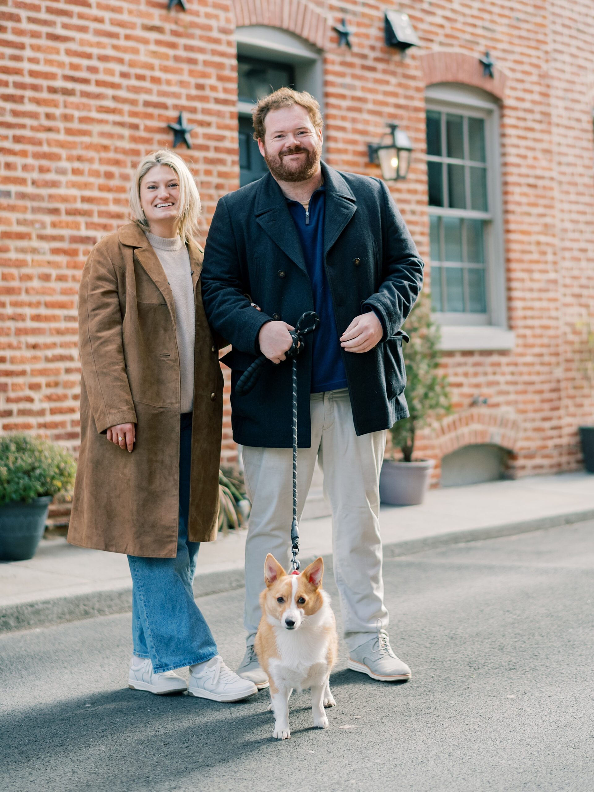 man and woman pose during winter Baltimore engagement session