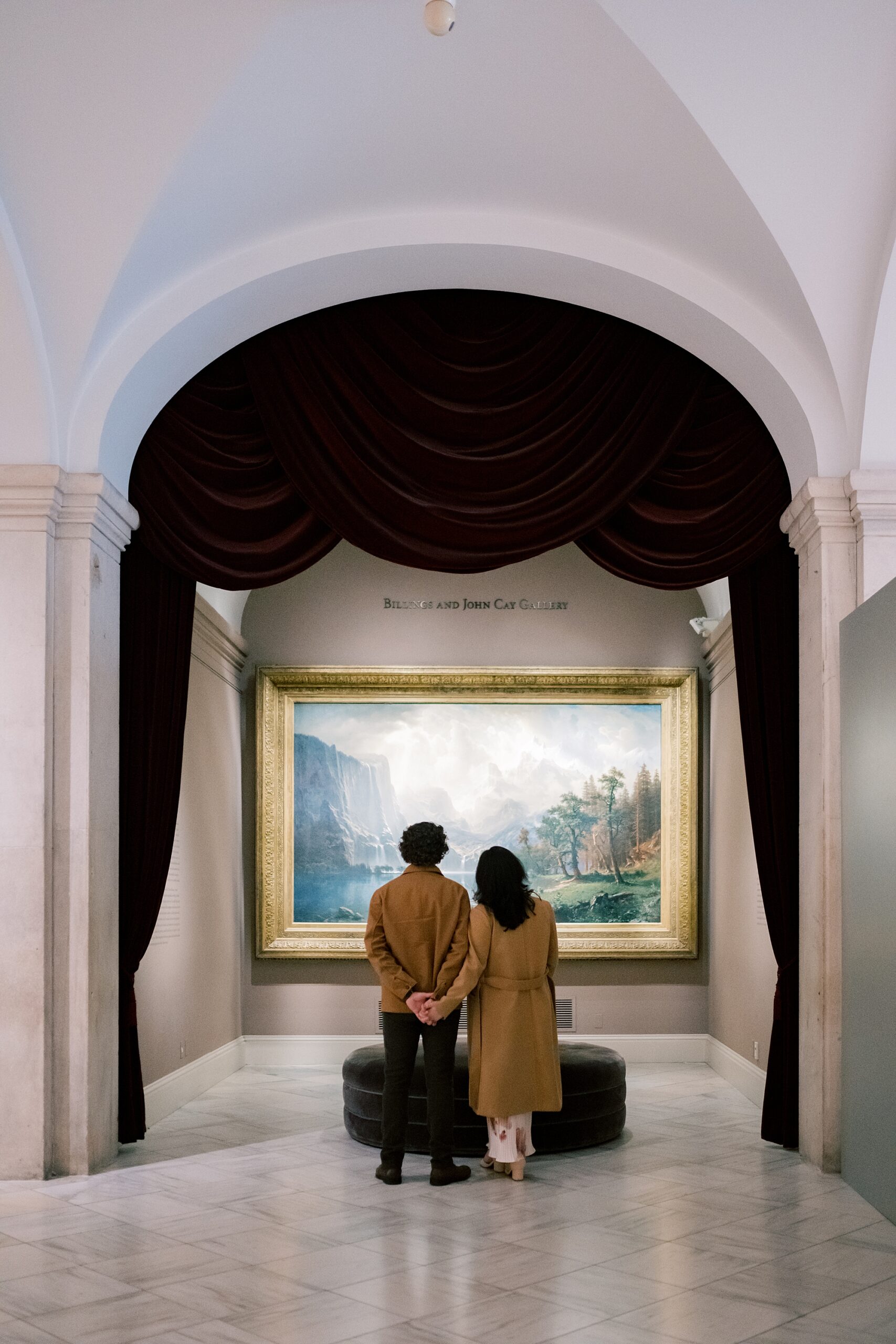 couple looks at painting during portraits at the National Portrait Gallery