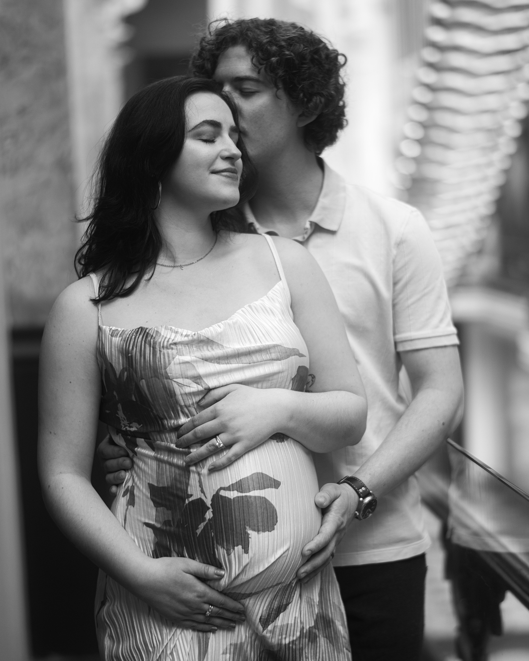 man and woman hug on balcony at the National Portrait Gallery