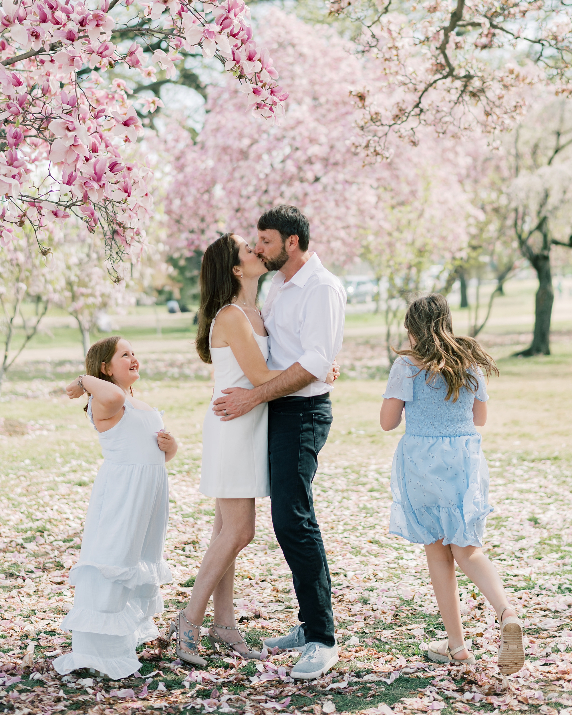 girls run around parents during spring photos in Washington DC