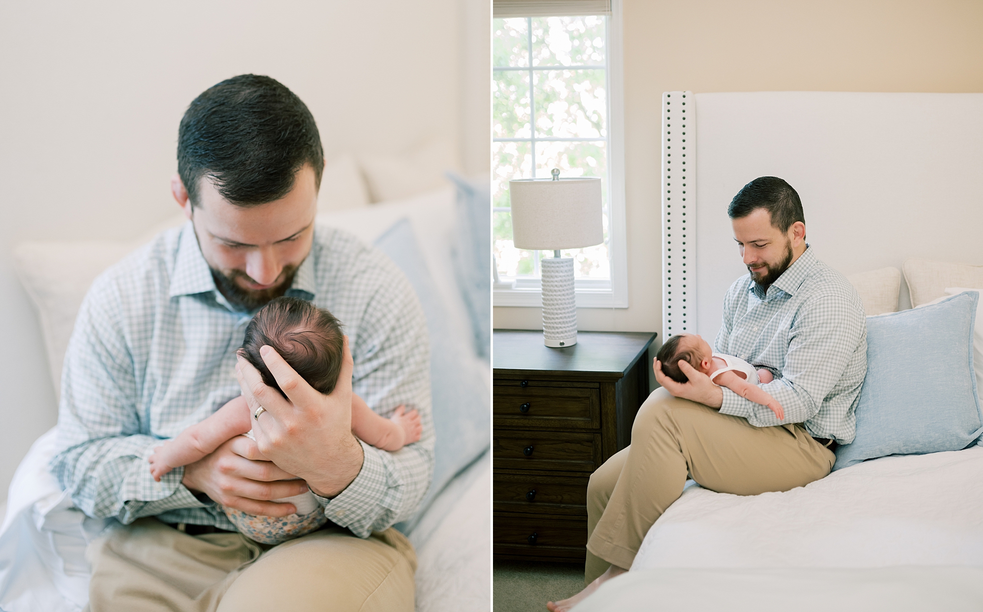 dad looks down at baby girl in his lap during newborn session at home