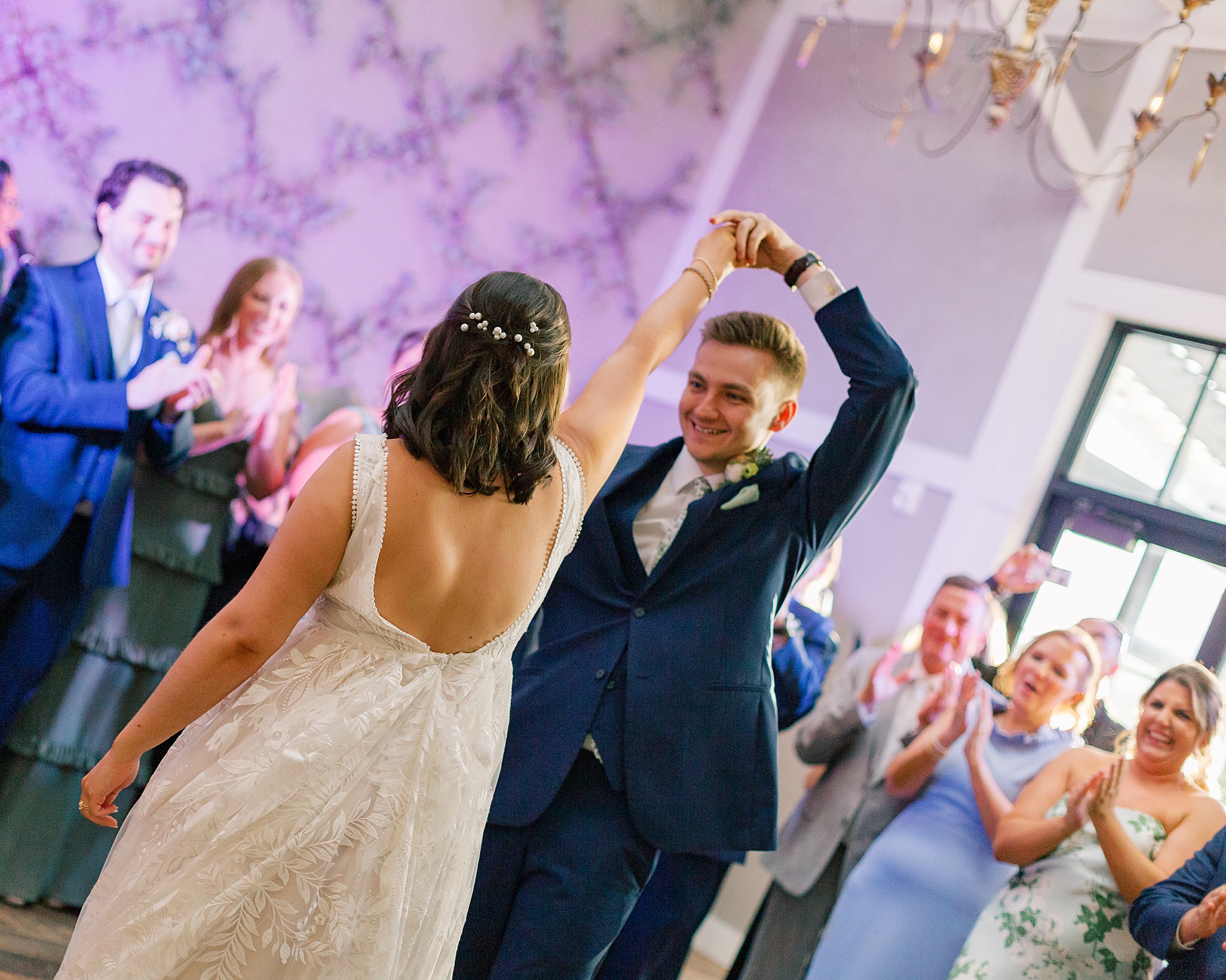 newlyweds dance together during reception in Doylestown PA