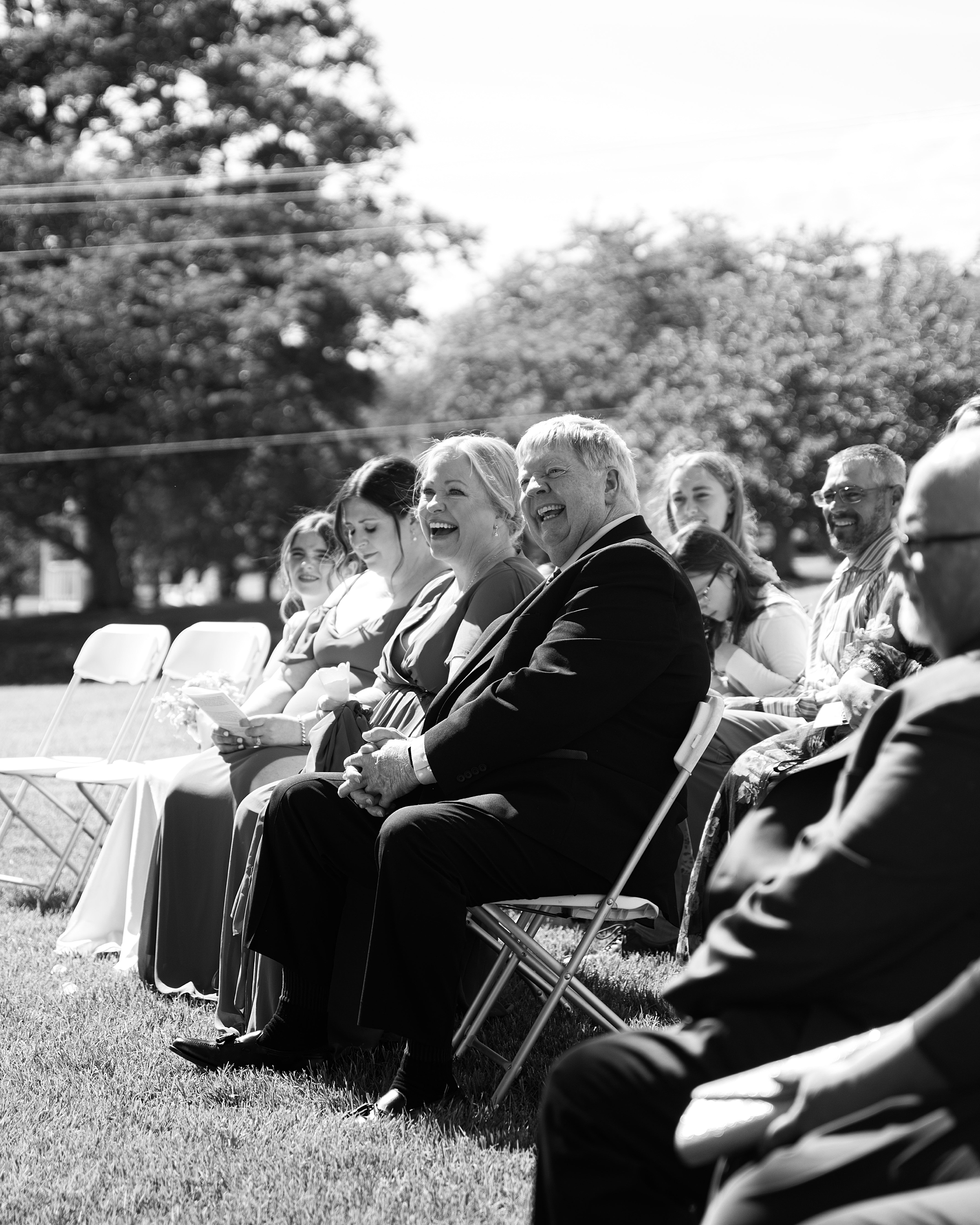 family laughs during wedding ceremony at Olde Breton Inn