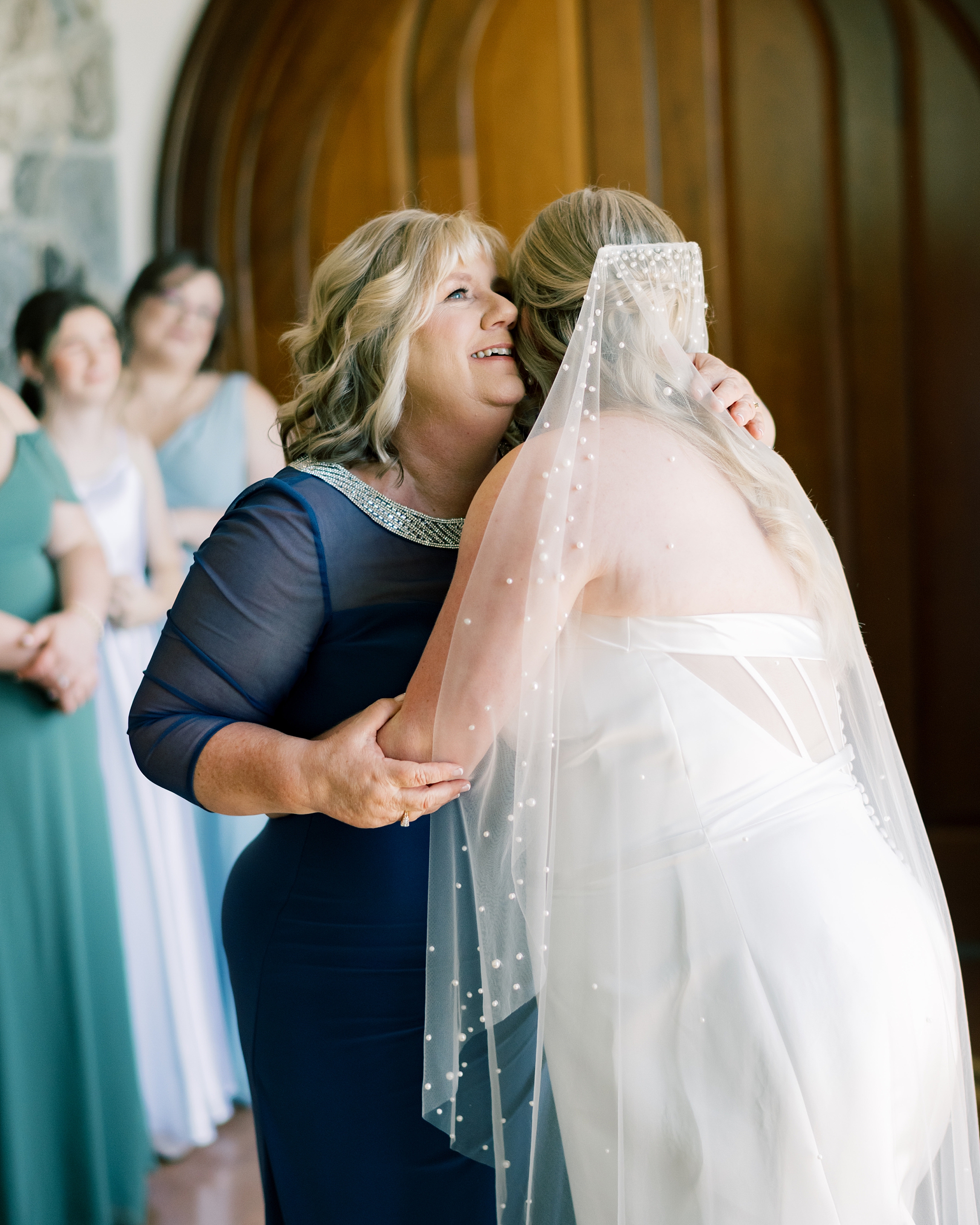 mother hugs bride during prep for Maryland wedding day