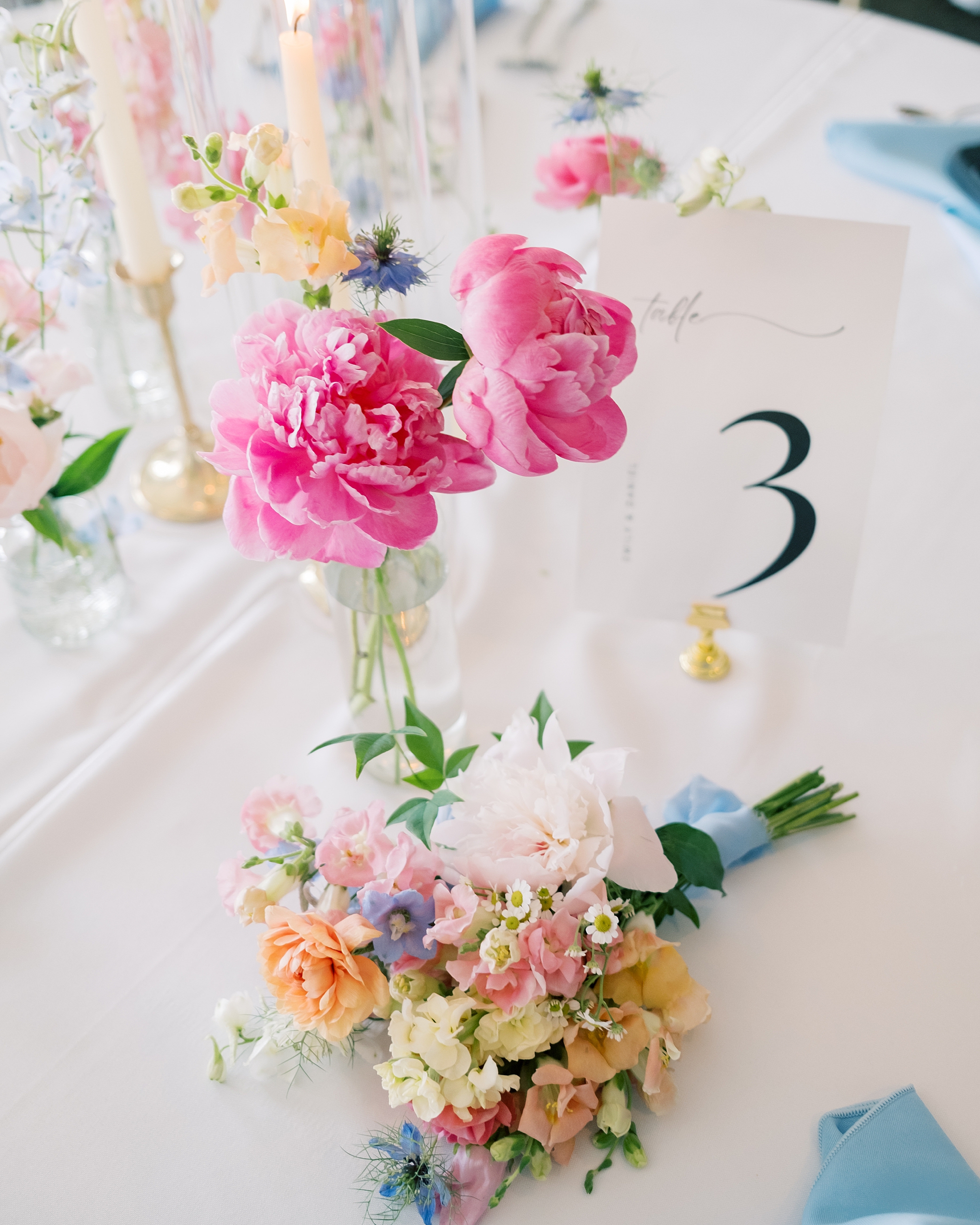 wedding reception at Olde Breton Inn with pink flowers and table numbers