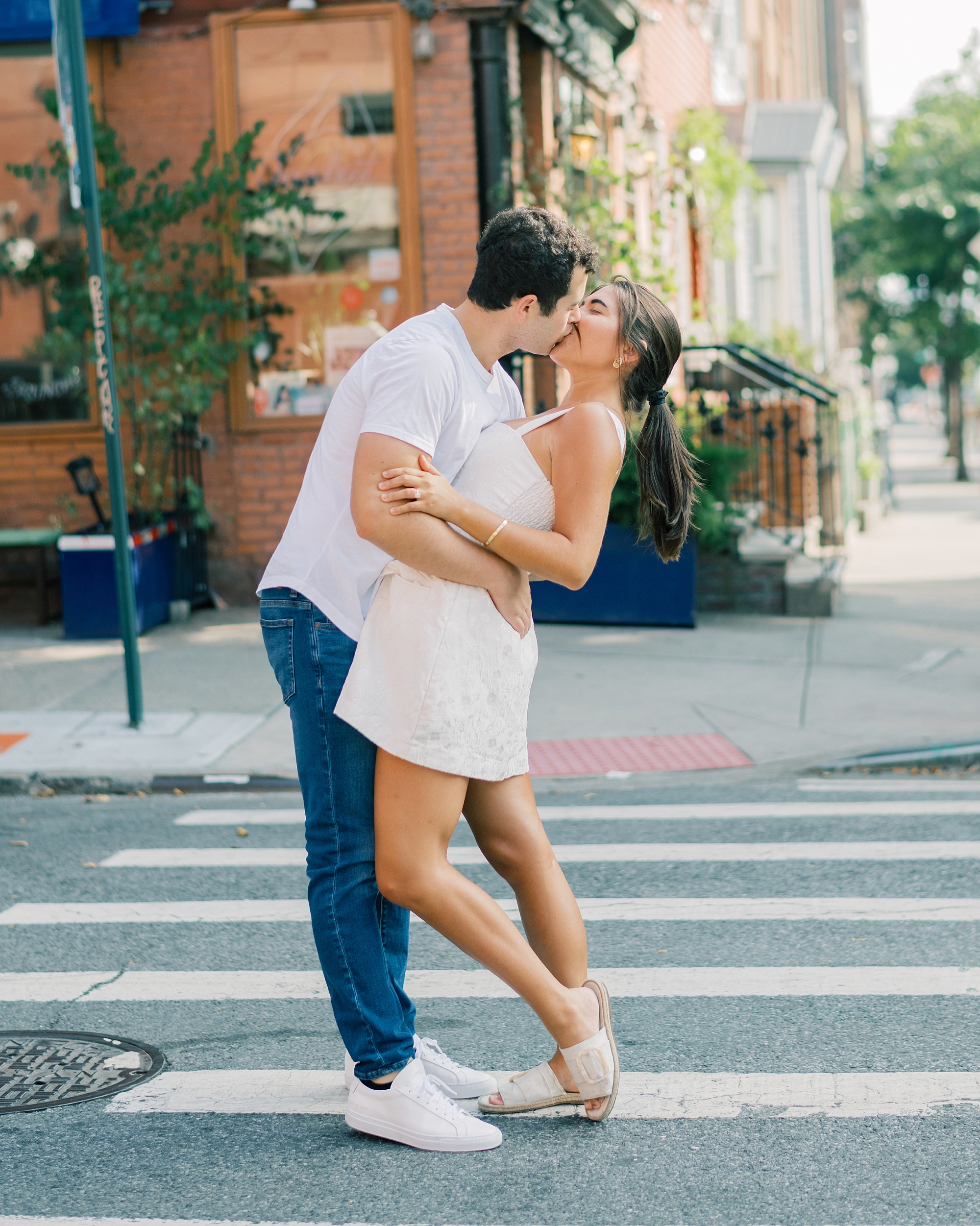man and woman kiss in streets of Williamsburg NYC