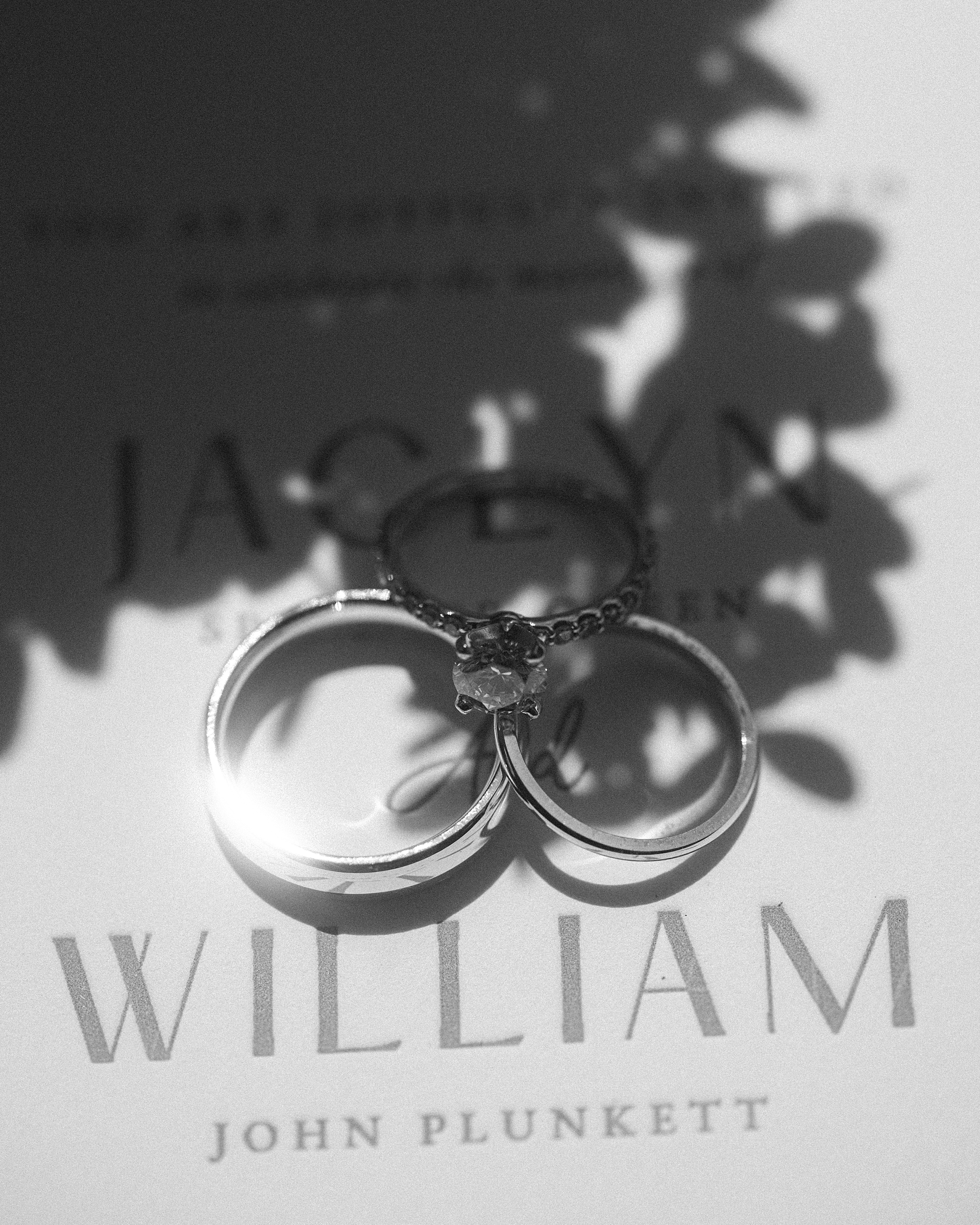wedding rings lay on stationery for wedding