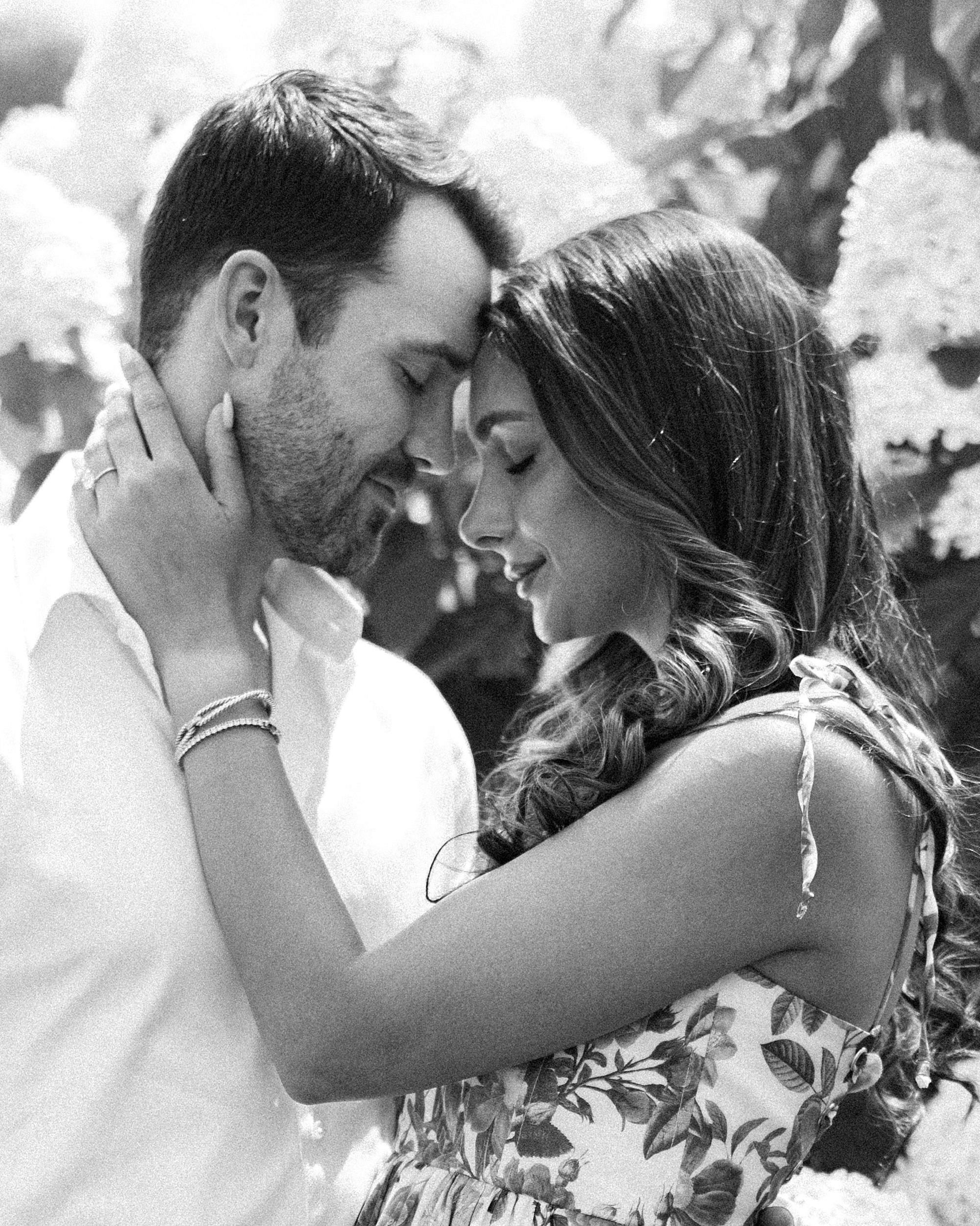 woman leans head into man's forehead during Stone Tower Winery engagement session