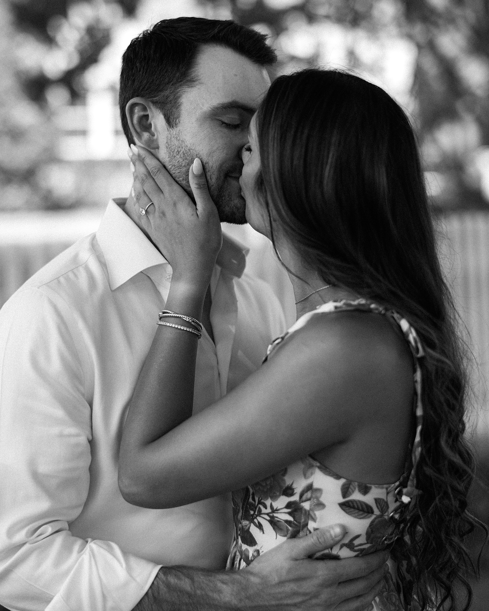 man and woman kiss during Stone Tower Winery engagement session
