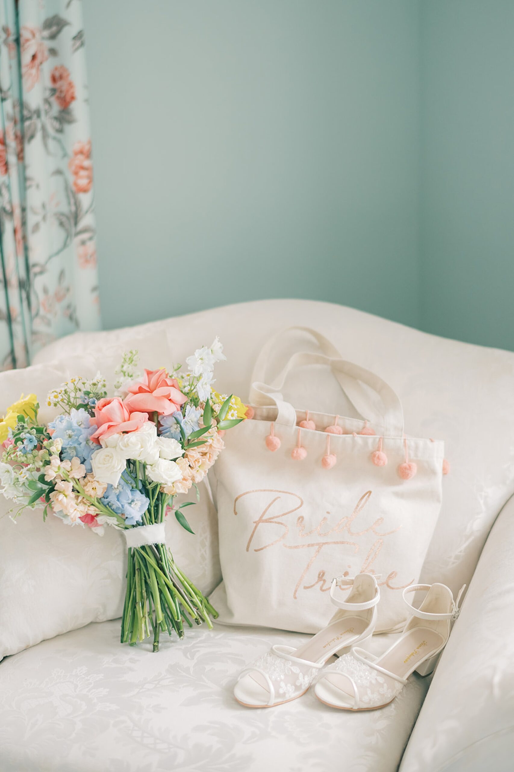 bride wedding shoes, custom bag, and soft floral bouquet 