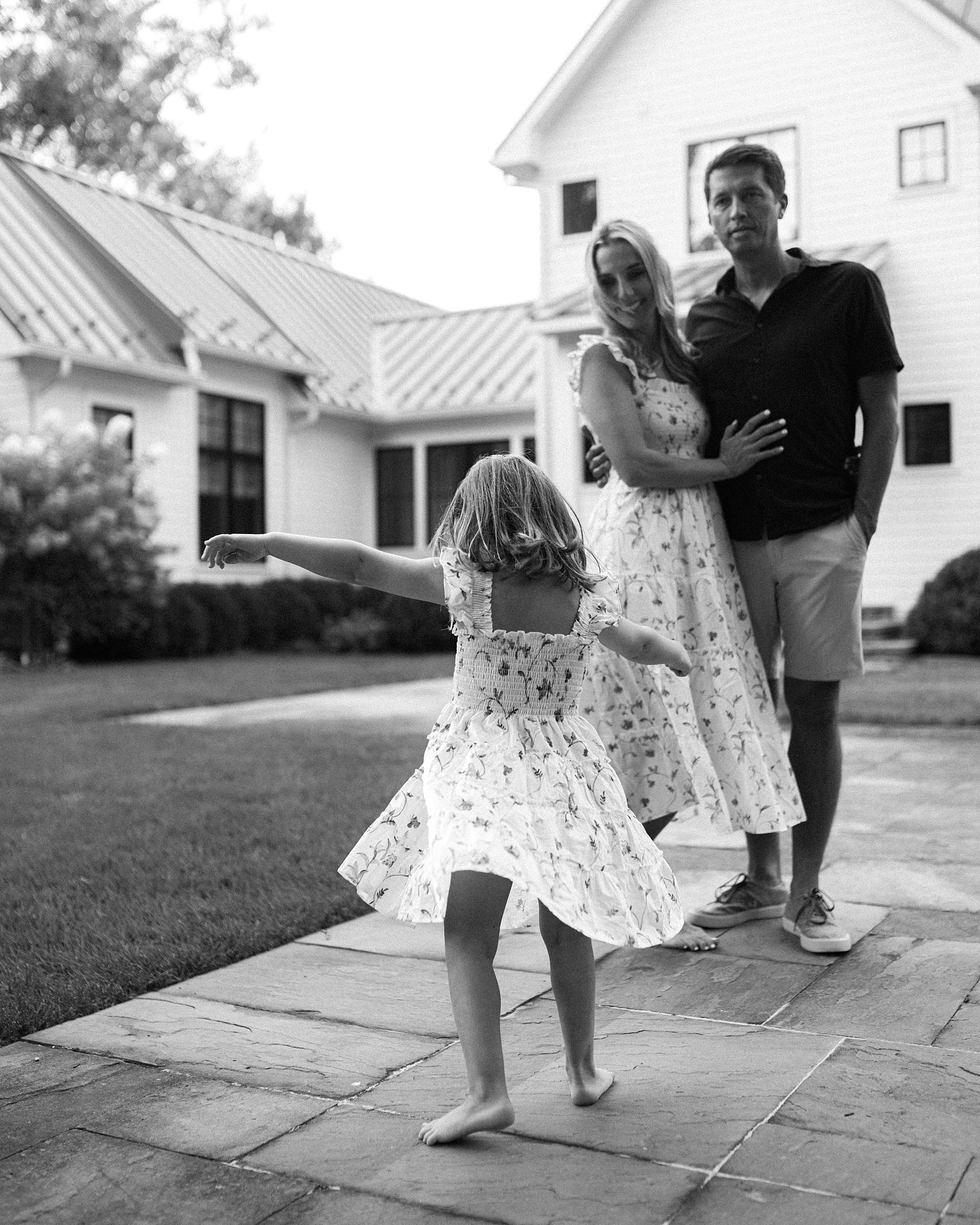 little girl twirls around 