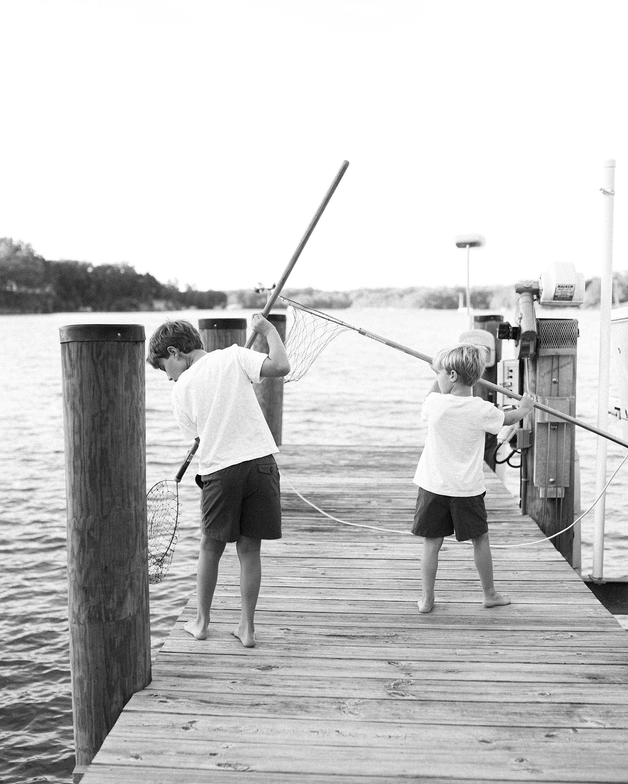 boys on pier in Southern Maryland crabbing 