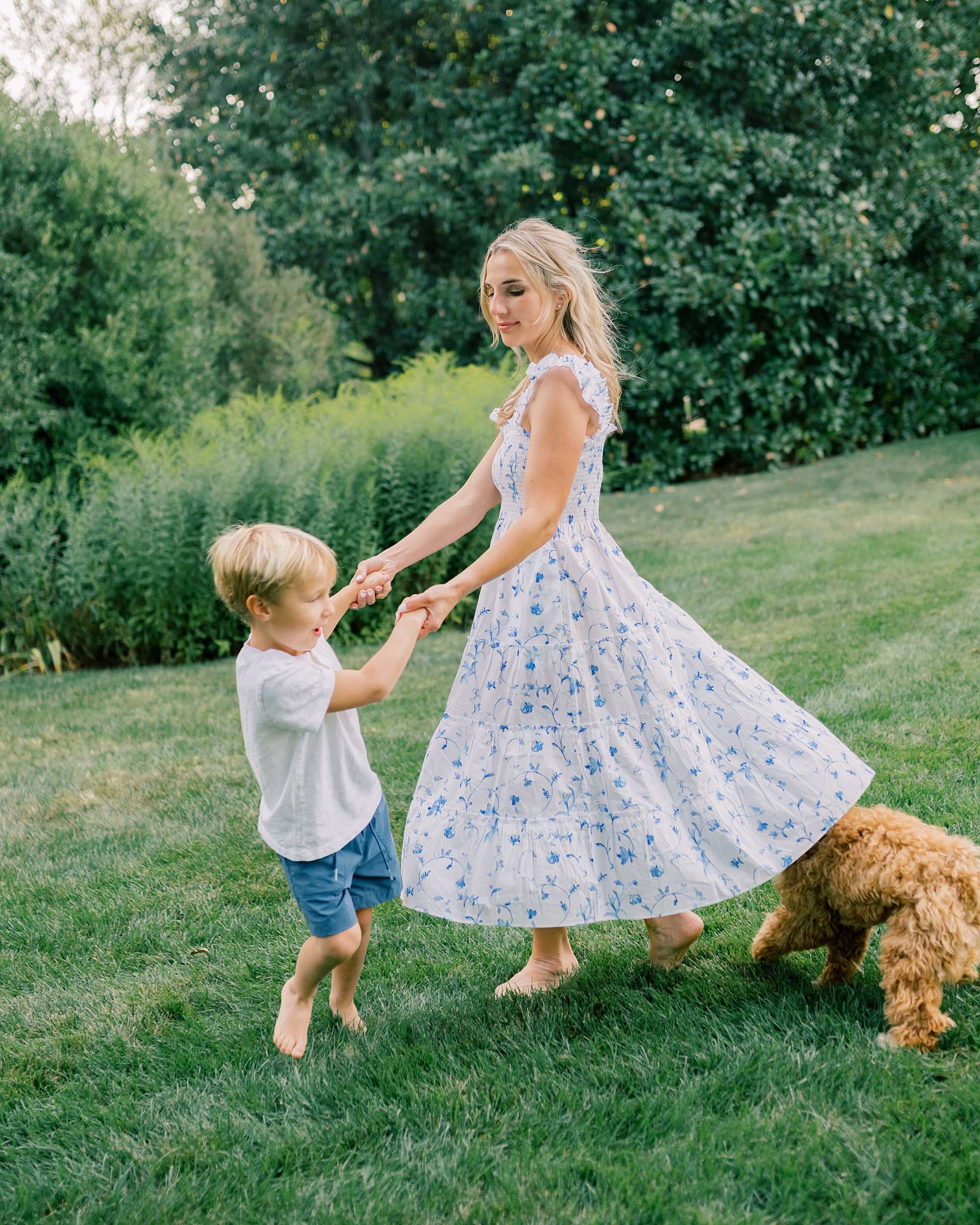 mom and son play in yard at family home