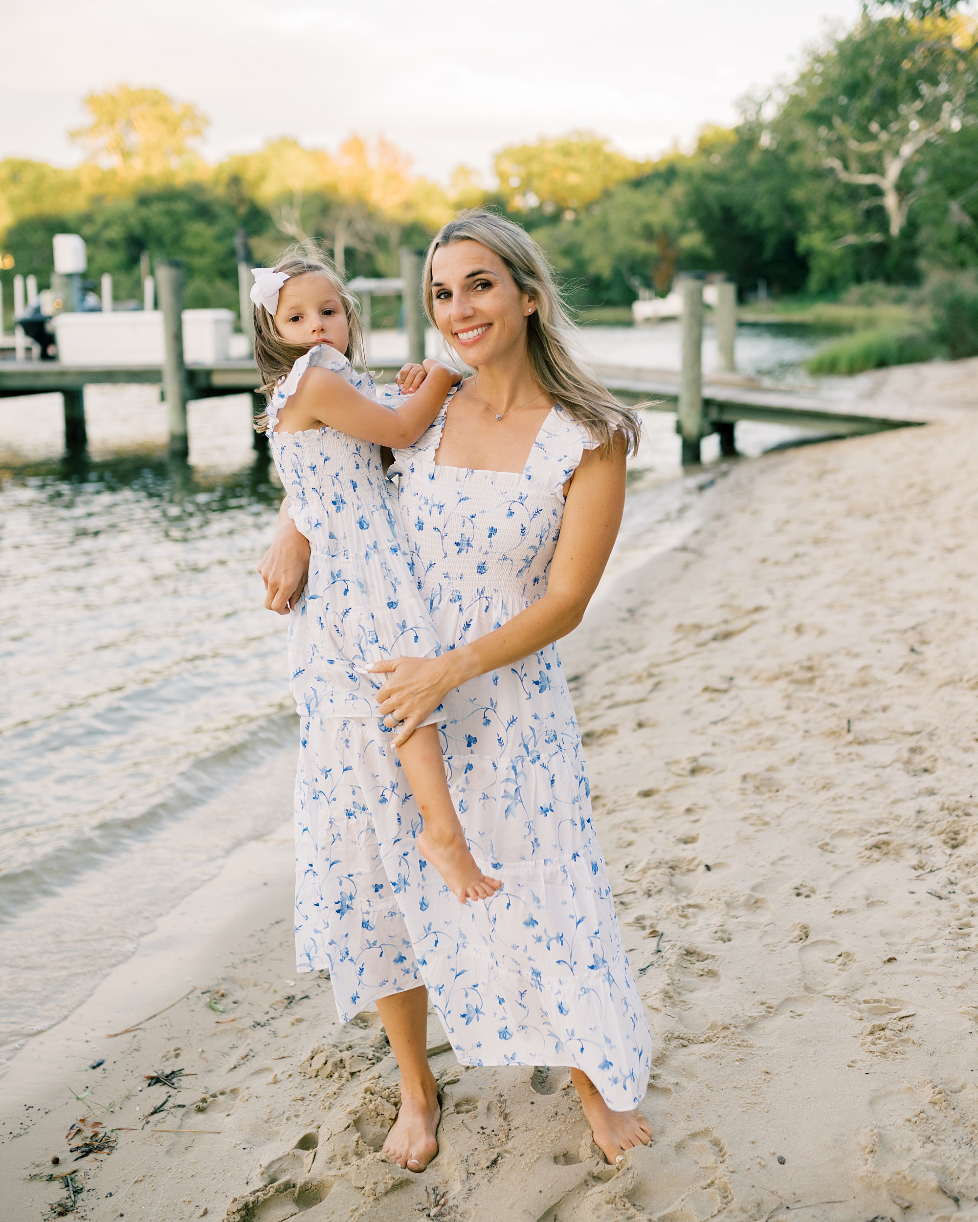 mom holds daughter in arms