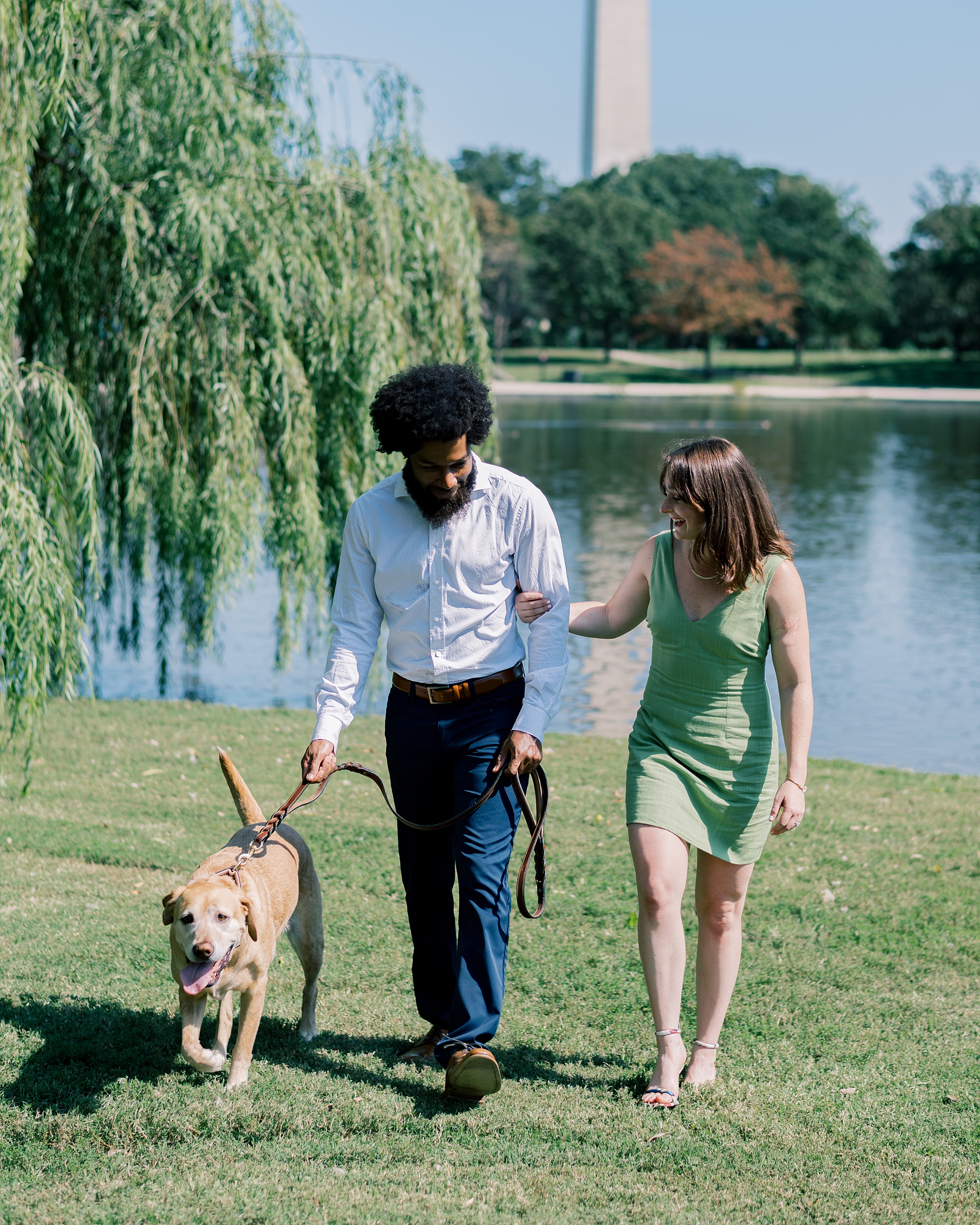 candid engagement photos of couple with their dog in Washington DC