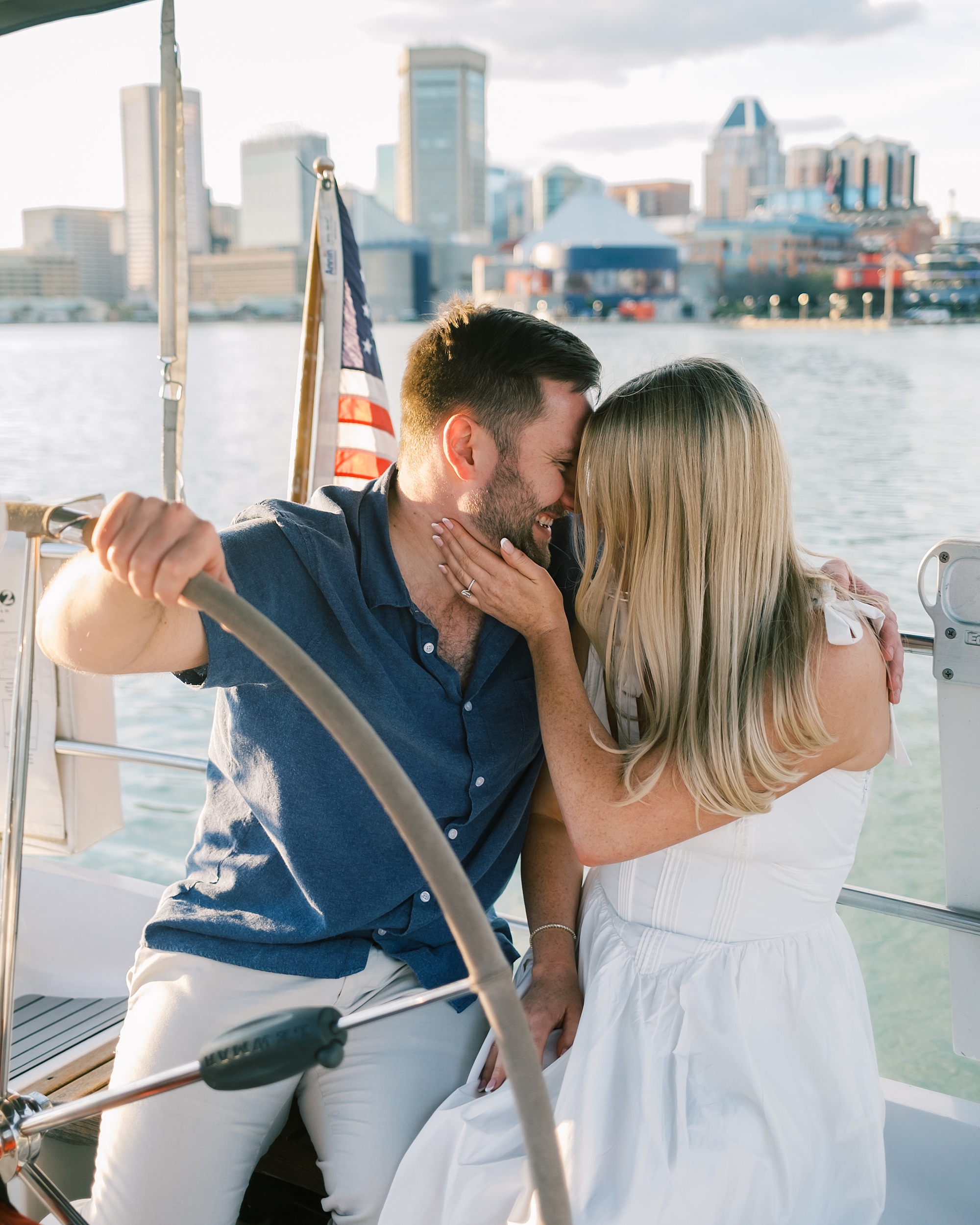 Romantic engagement portraits on sailboat in Baltimore's Inner Harbor