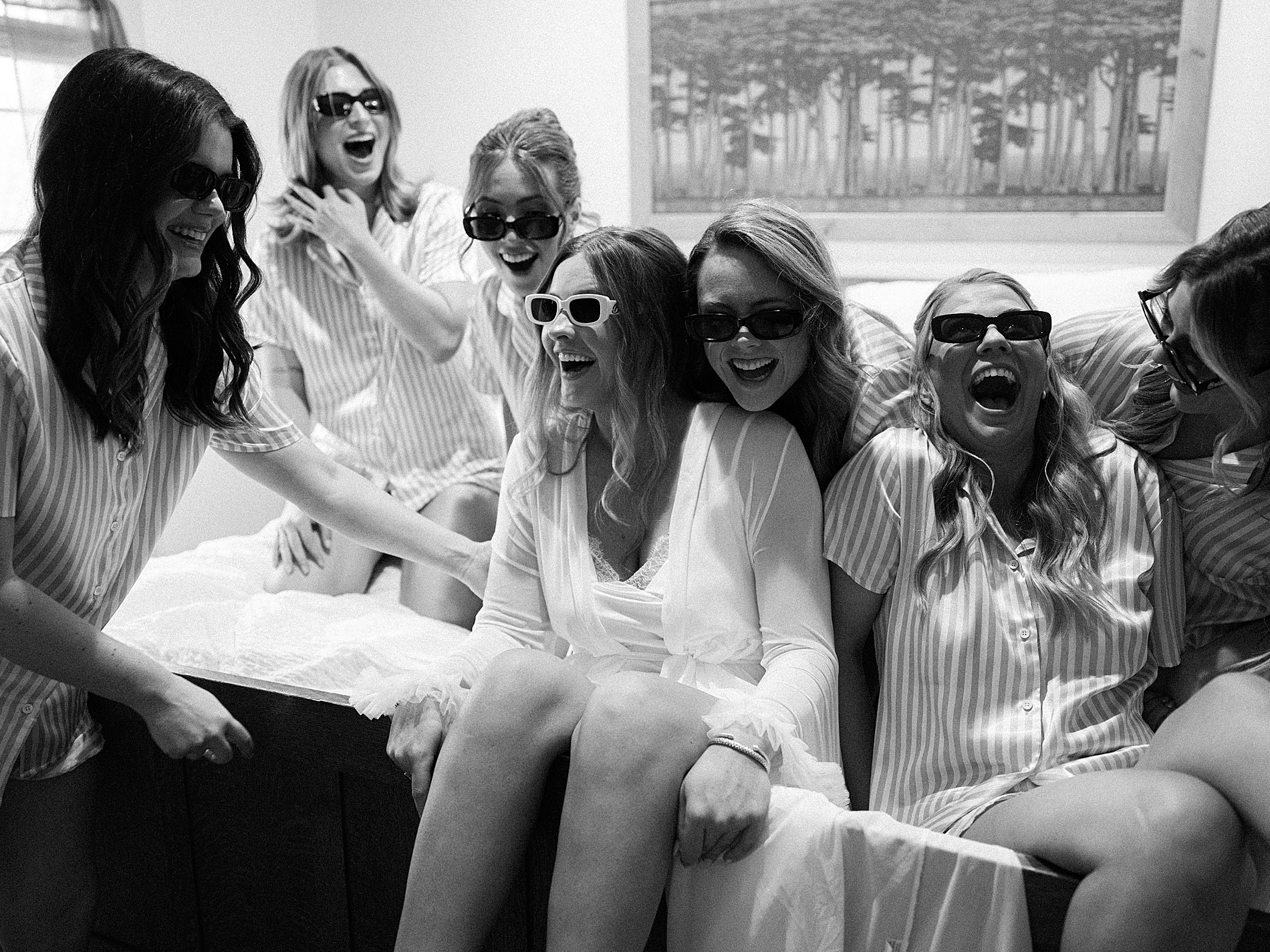 candid getting ready photos of bride and bridesmaids 