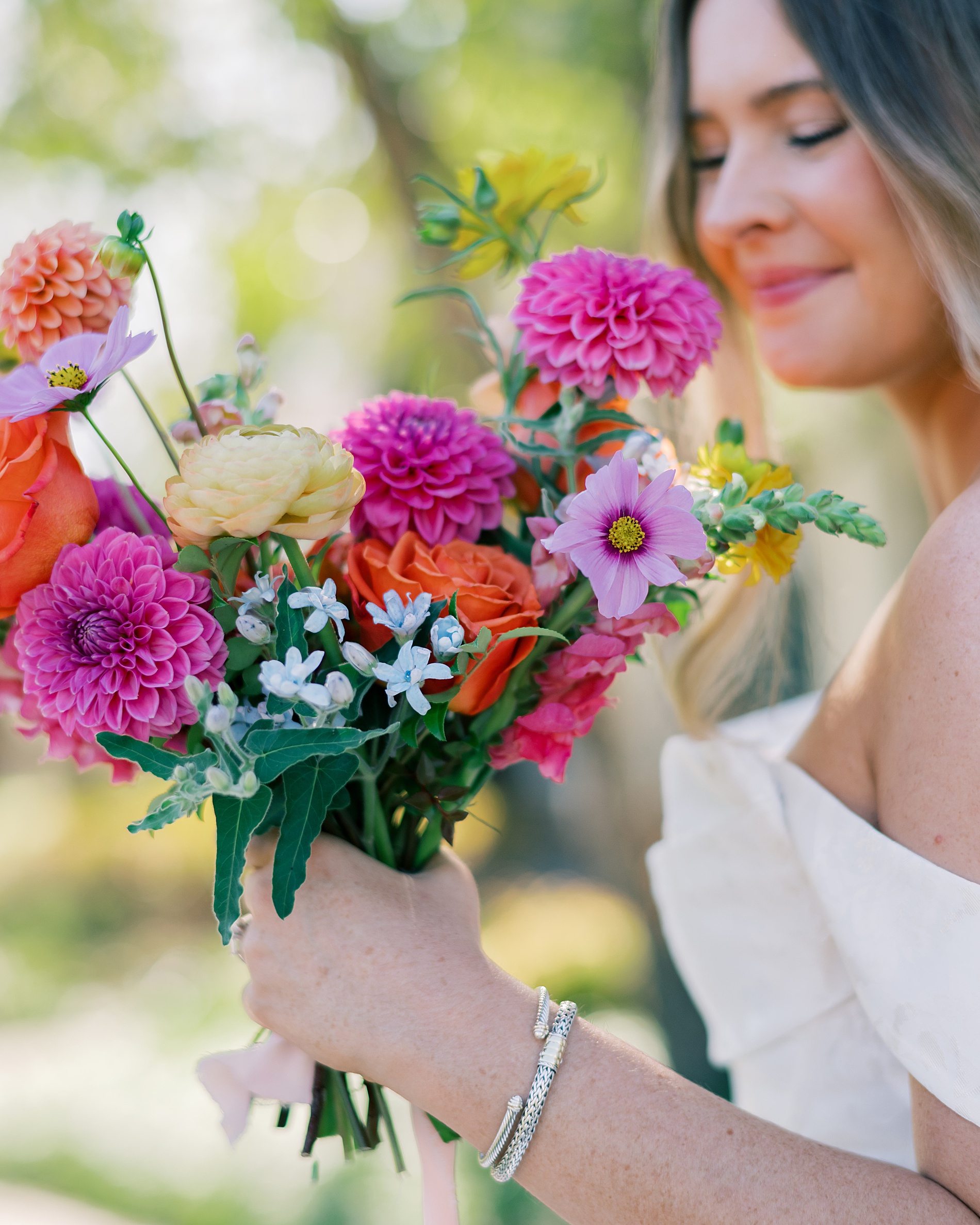 bride with colorful bouquet of flowers 