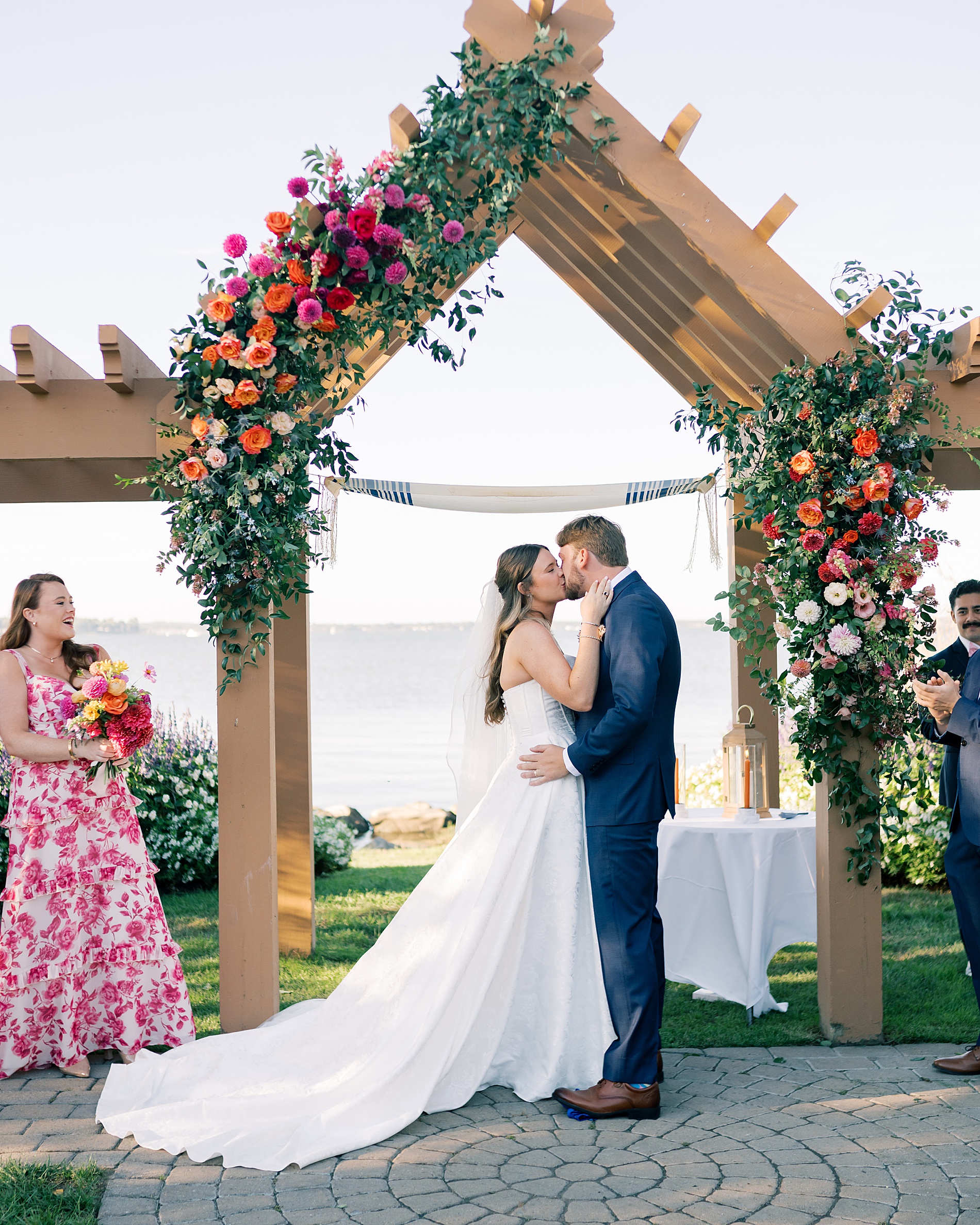 newlyweds kiss during ceremony at Herrington on the Bay
