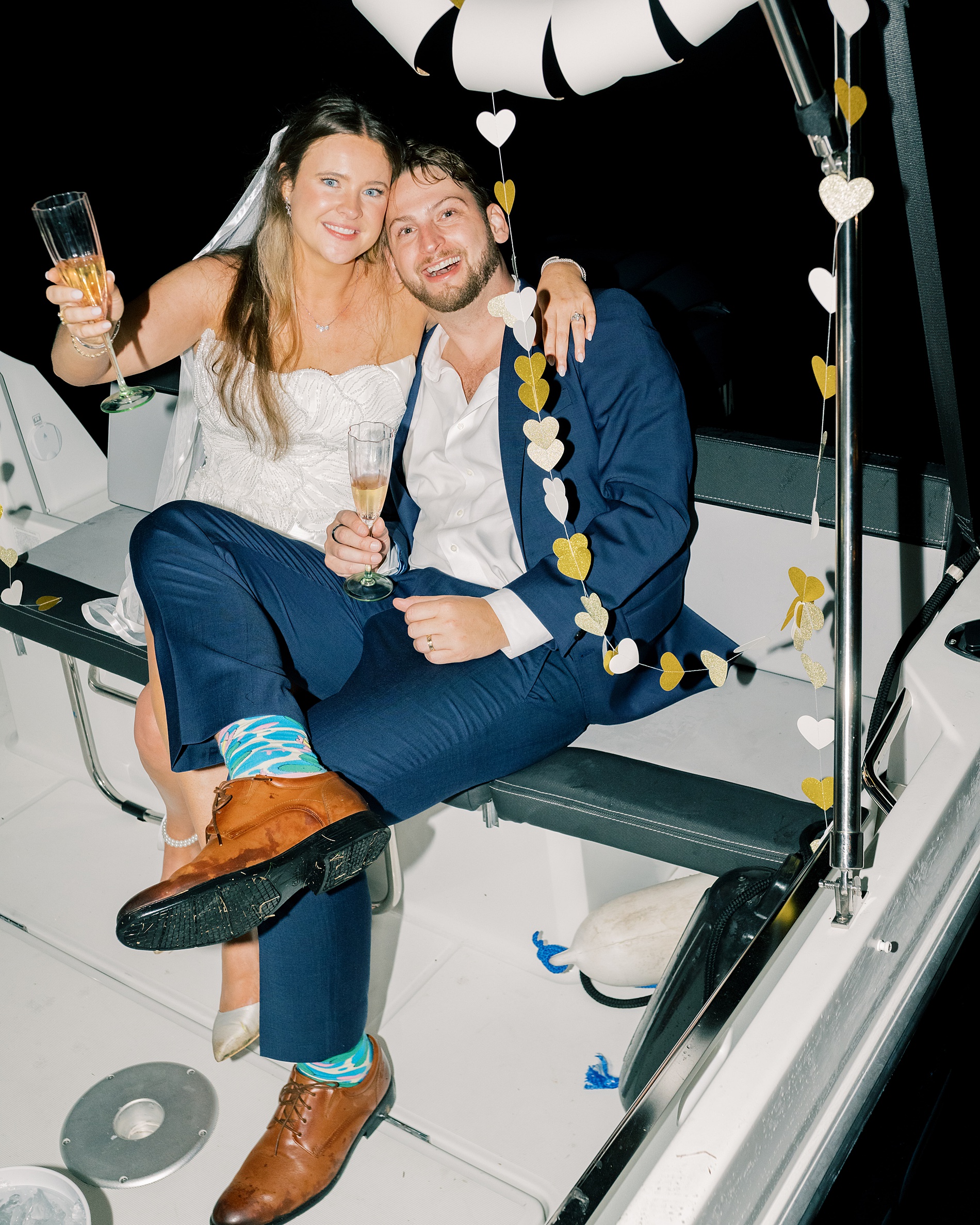 newlyweds on getaway boat