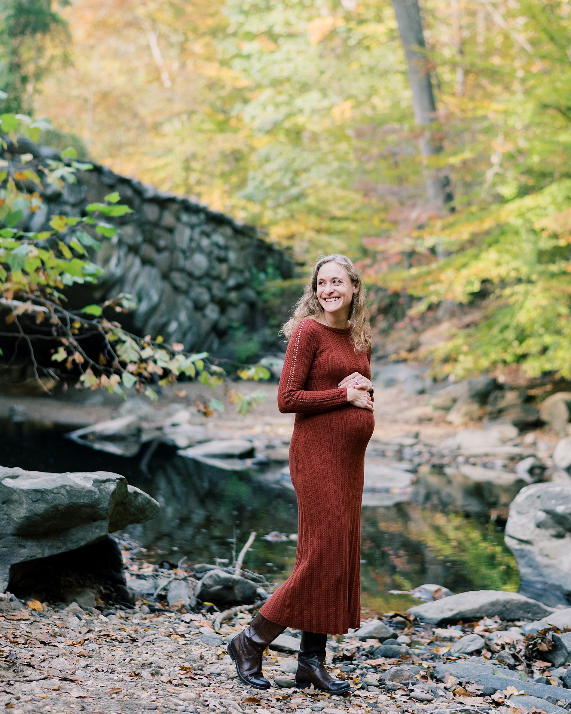 expectant mom in burnt orange sweater dress