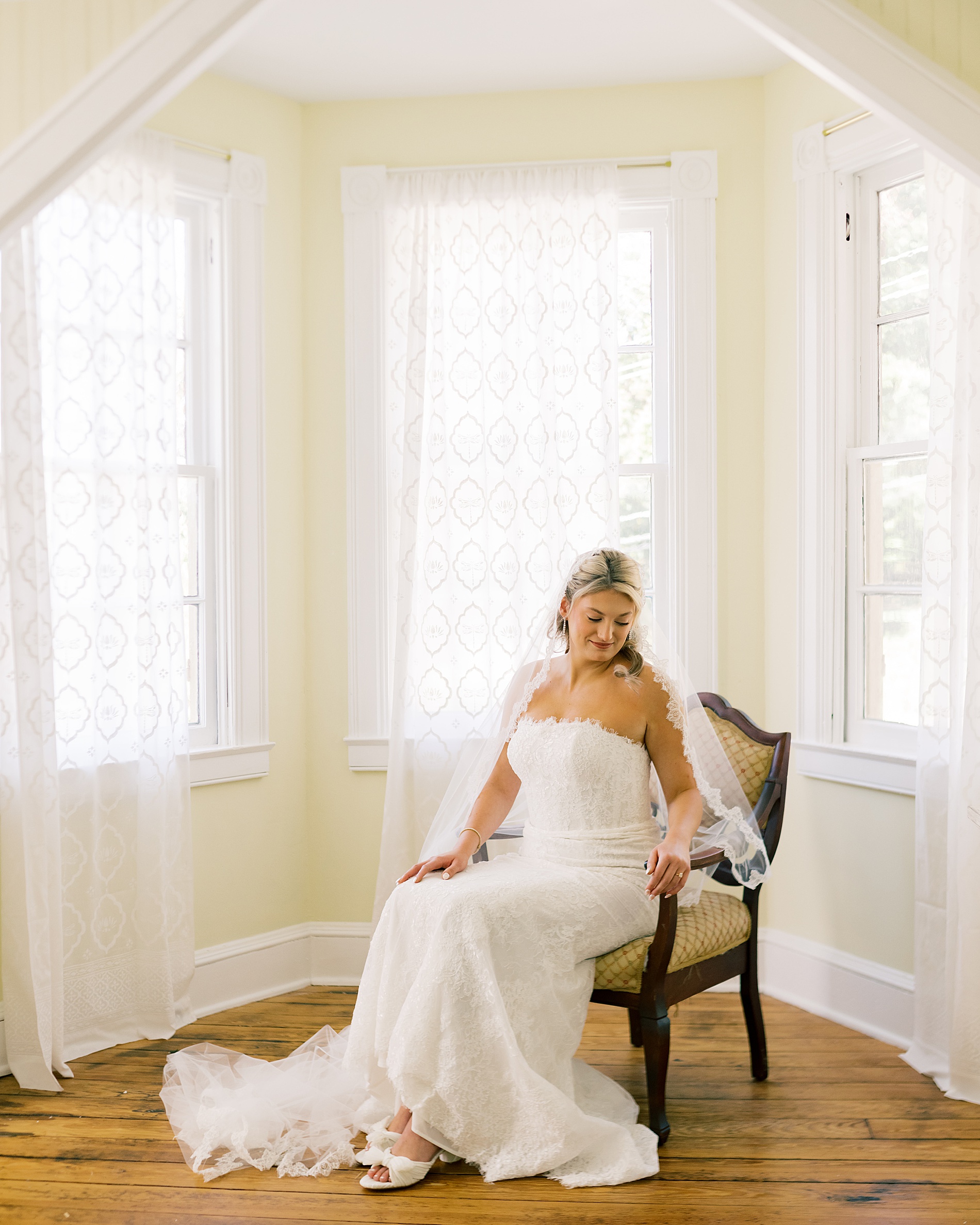 bridal portraits in chair at Classic Wedding at the Evergreen Library in Baltimore, MD