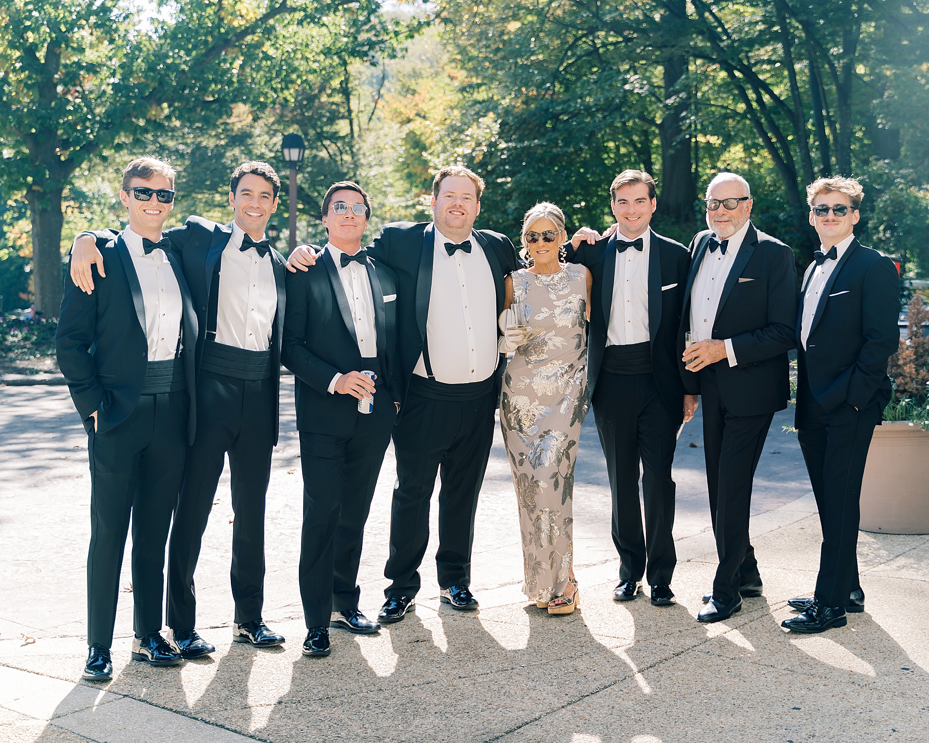 groom with mom and groomsmen