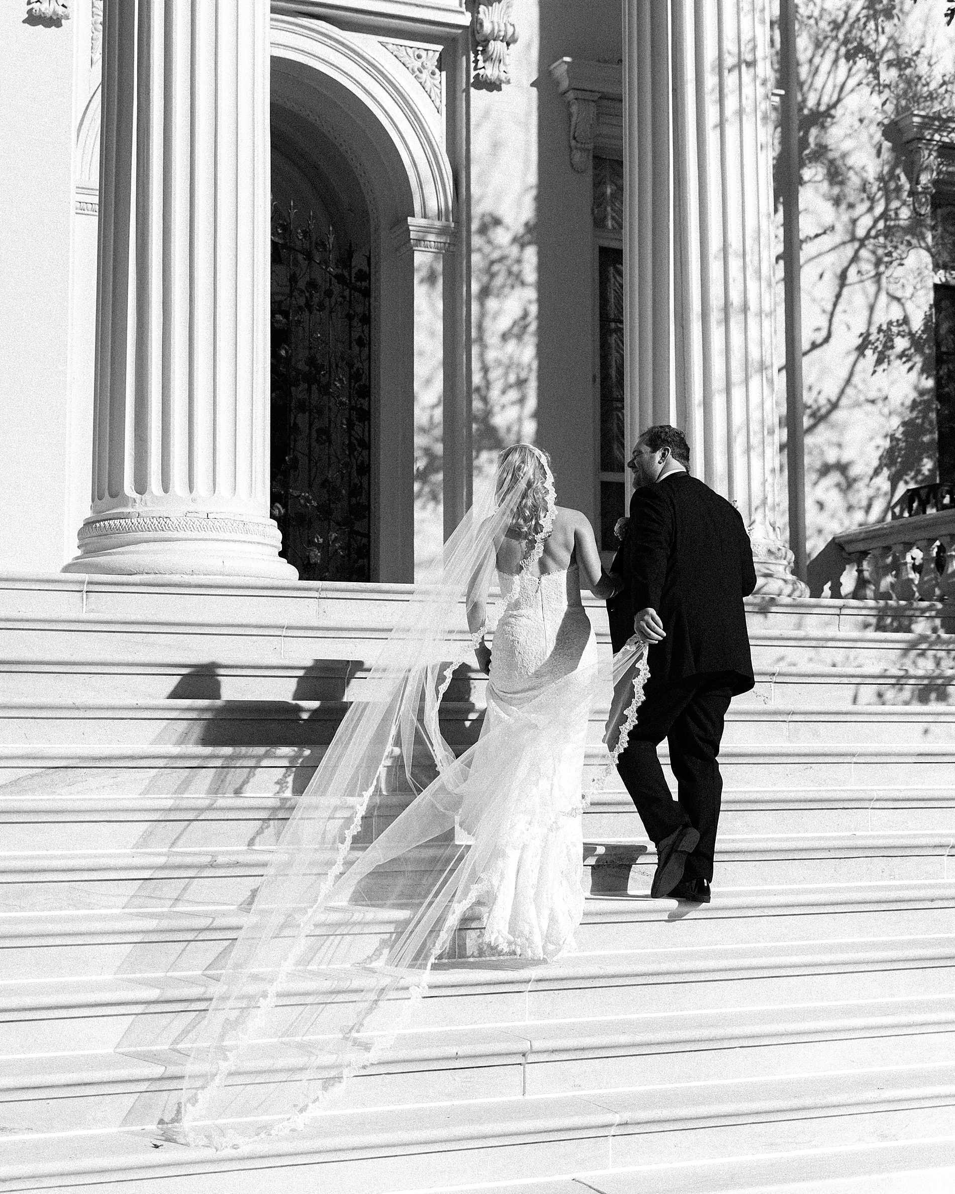 couple walk up stairs of Evergreen library 
