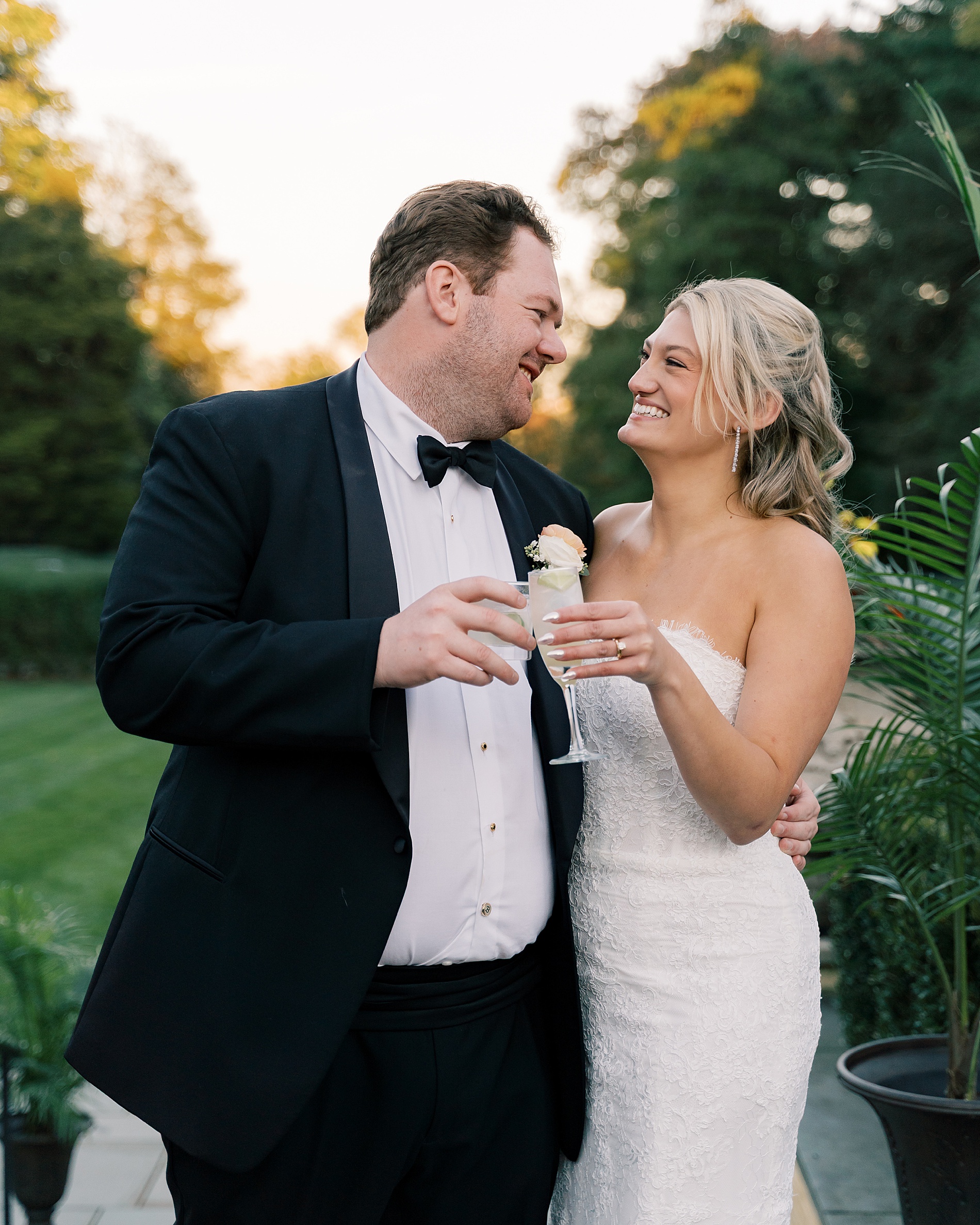 bride and groom share first drink together after wedding ceremony 