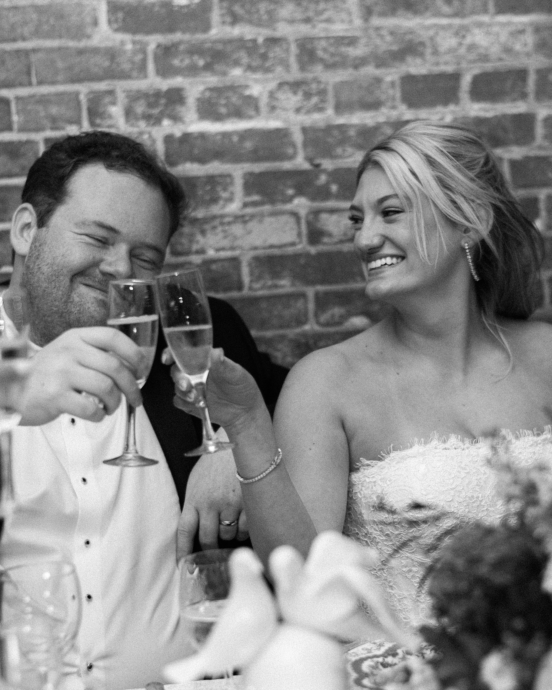 bride and groom toast during wedding speeches