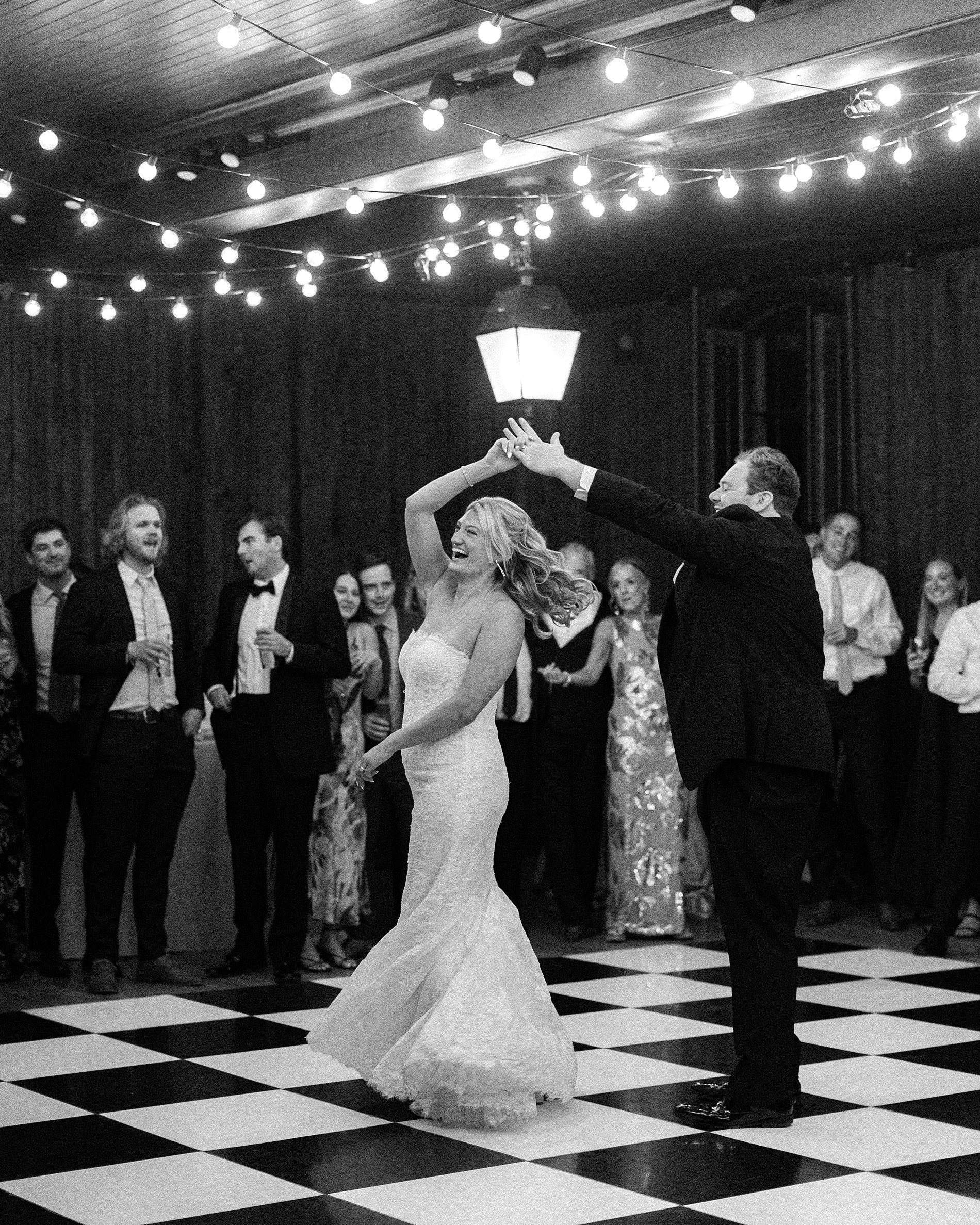 Candid dance floor moments of bride and groom