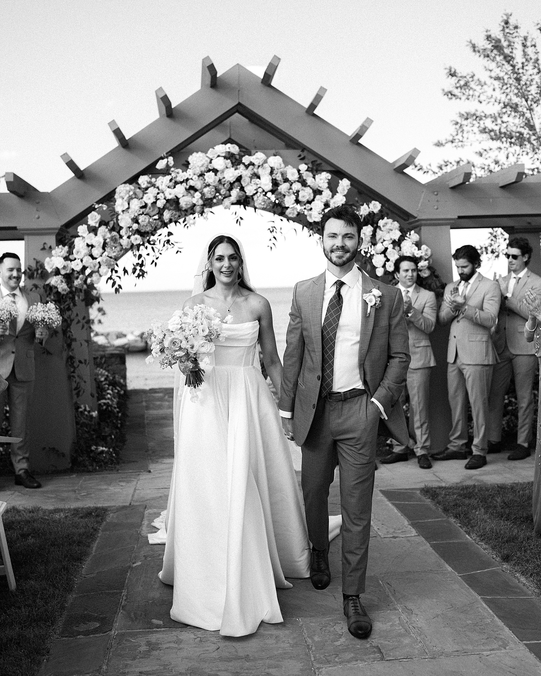 newlyweds walk down aisle together as husband and wife 