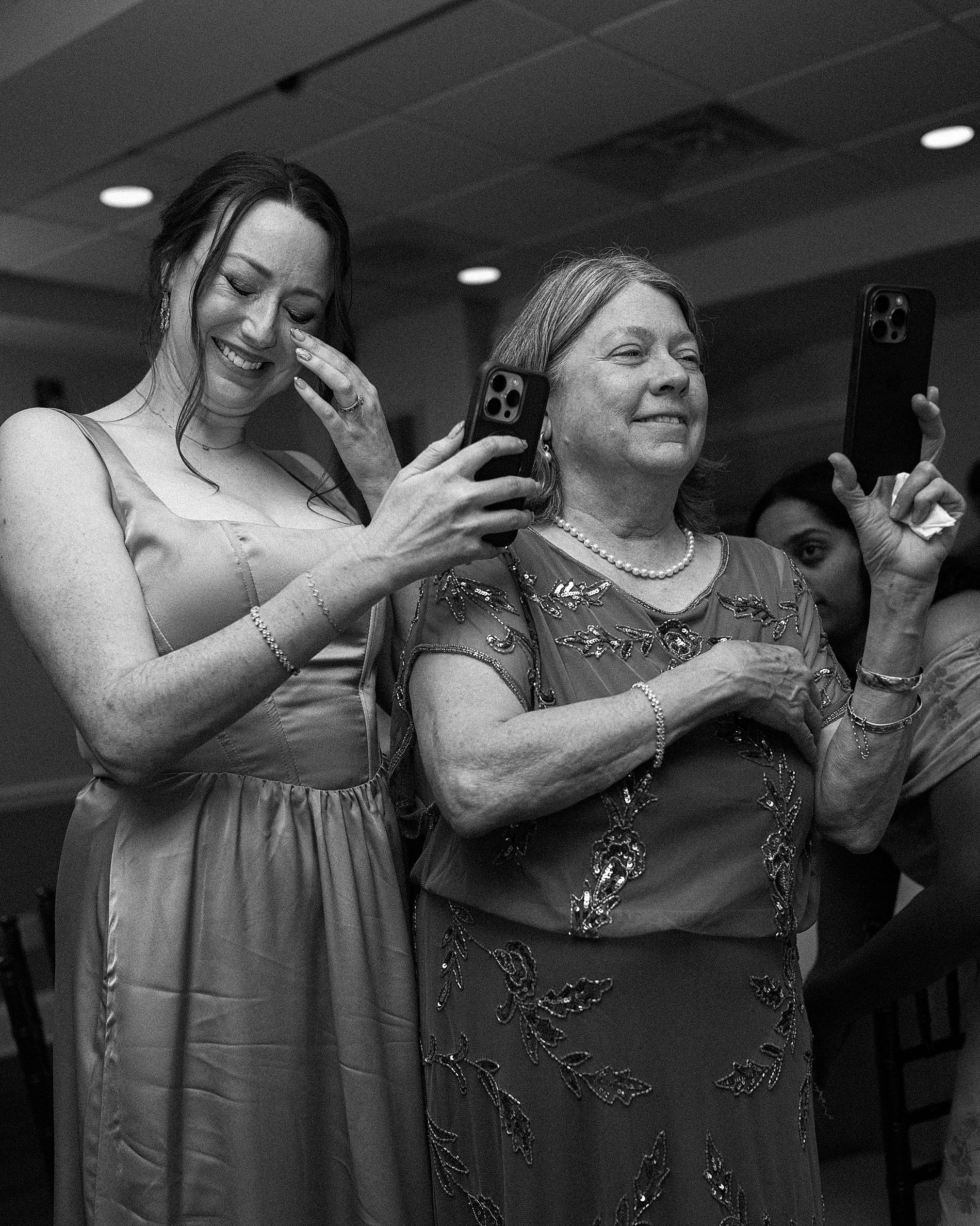 wedding guests wipe away tears during first dance
