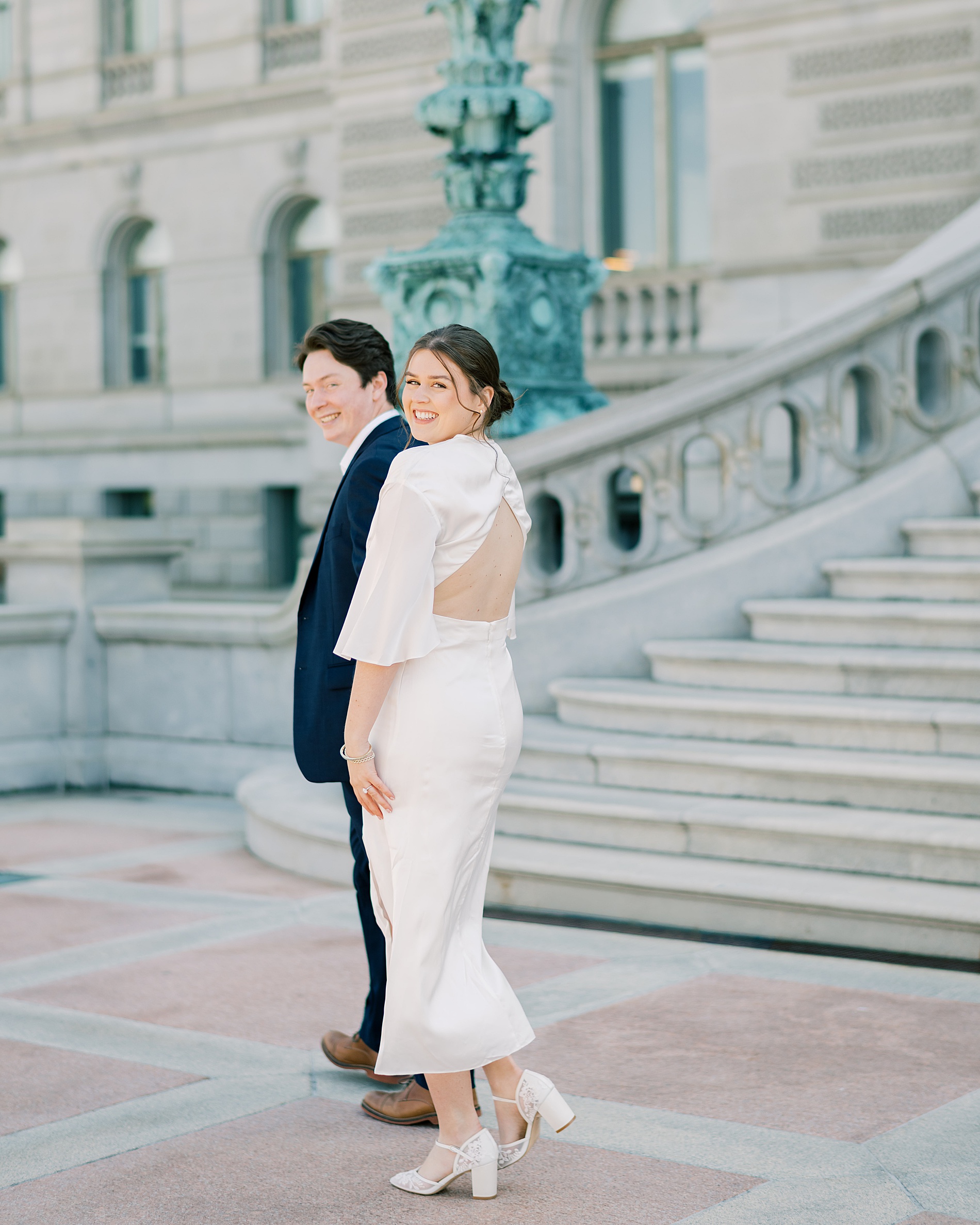 woman in sophisticated and flirty dress for engagement session 